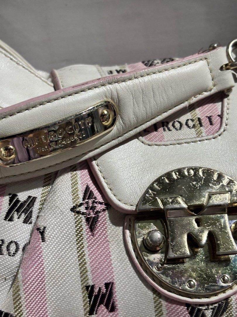 Metrocity Pink White Striped Pattern Shoulder Bag Handbag (Category: Luxury Bags & Wallets) located in Rizal. Submitted by va_nes_sa_ (Listing ID 1470819526, Image 3). Description: - Brand: Metrocity RARE ITEM - Material: Pink and white striped canvas with monogram print and white leather trim - Straps & Closure: Metallic chain strap and large front turn-lock closure with metallic branding - Interior: Fabric lining featuring the Metrocity logo pa
