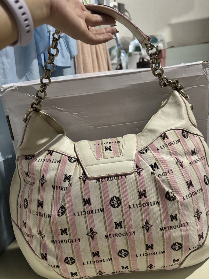 Metrocity Pink White Striped Pattern Shoulder Bag Handbag (Category: Luxury Bags & Wallets) located in Rizal. Submitted by va_nes_sa_ (Listing ID 1470819526, Image 2). Description: - Brand: Metrocity RARE ITEM - Material: Pink and white striped canvas with monogram print and white leather trim - Straps & Closure: Metallic chain strap and large front turn-lock closure with metallic branding - Interior: Fabric lining featuring the Metrocity logo pa