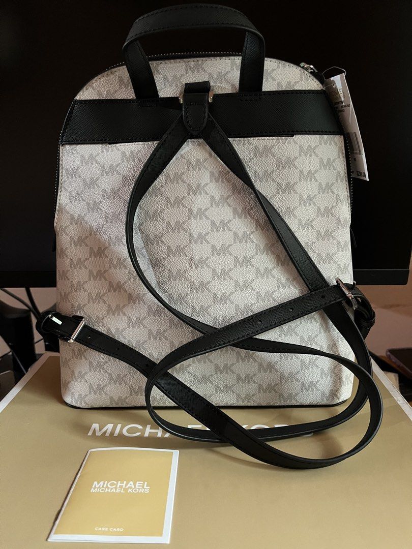 Michael Kors Cindy Large Bagpack (Category: Backpacks) located in Santa Rosa. Submitted by ninaparis (Listing ID 1470925287, Image 2). Description: Original Michael Kors Cindy Large Center Stripe Backpack in the Bright White Multi(Gray and Black Monogram)colorway.