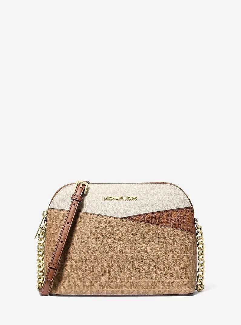 Michael Kors Jet Set Dome Crossbody Bag (Category: Cross-body Bags) located in Paranaque City. Submitted by MLandCobyApple (Listing ID 1470887701, Image 1). Description: - Authentic Michael Kors dome crossbody bag in signature MK logo print - Chic colorblock design in white, tan, and brown tones - Premium gold-tone hardware with stylish chain strap links - Secure zip-top closure and convenient front slip pocket - Adjustable leather shoulder strap