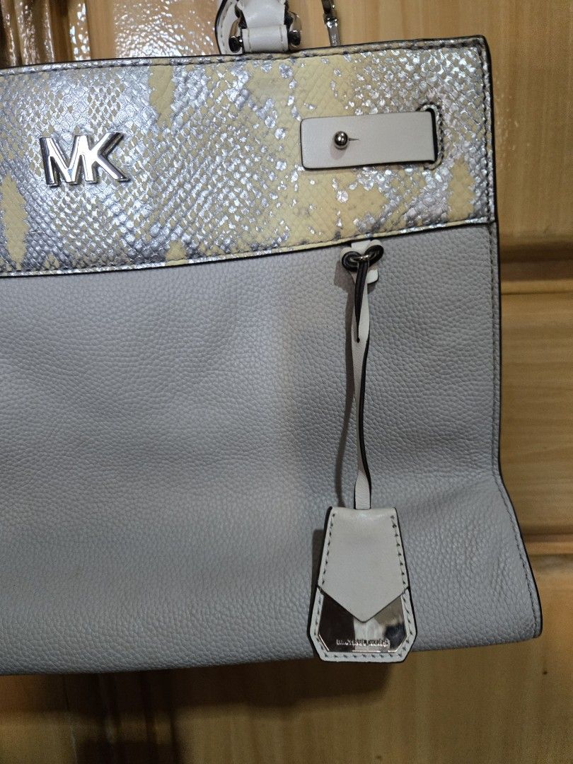 Michael Kors Two-Tone Tote Bag with Snakeskin Panel (Category: Tote Bags) located in Quezon City. Submitted by mycloset_2016 (Listing ID 1470767837, Image 2). Description: - Brand: Michael Kors - Material: Premium grey pebble leather with silver and yellow snakeskin print panel - Hardware: Silver-tone with prominent MK logo and protective metal base feet - Compartments: Multiple interior storage spaces with a secure center zip divider - Straps: S