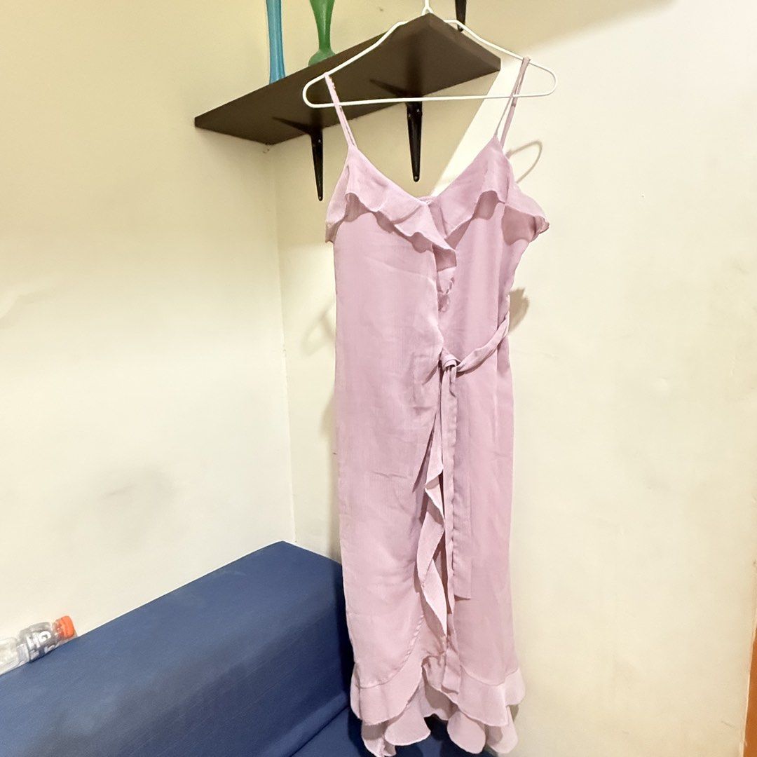 Midi lavender Spaghetti Strap Ruffle Wrap Dress (Category: Dresses) located in Cebu City. Submitted by mayanng_12 (Listing ID 1470834829, Image 1). Description: - Color: Dusty pink - Style: Midi dress with spaghetti straps and V-neckline - Details: Cascading front ruffles, matching waist tie, and ruffled hem - Fabric: Lightweight with a gentle drape - Perfect for: Warm weather outings, dates, and weekend brunches.