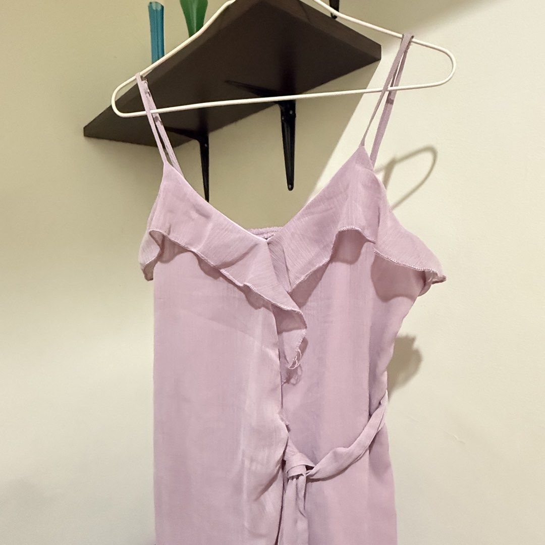 Midi lavender Spaghetti Strap Ruffle Wrap Dress (Category: Dresses) located in Cebu City. Submitted by mayanng_12 (Listing ID 1470834829, Image 2). Description: - Color: Dusty pink - Style: Midi dress with spaghetti straps and V-neckline - Details: Cascading front ruffles, matching waist tie, and ruffled hem - Fabric: Lightweight with a gentle drape - Perfect for: Warm weather outings, dates, and weekend brunches.
