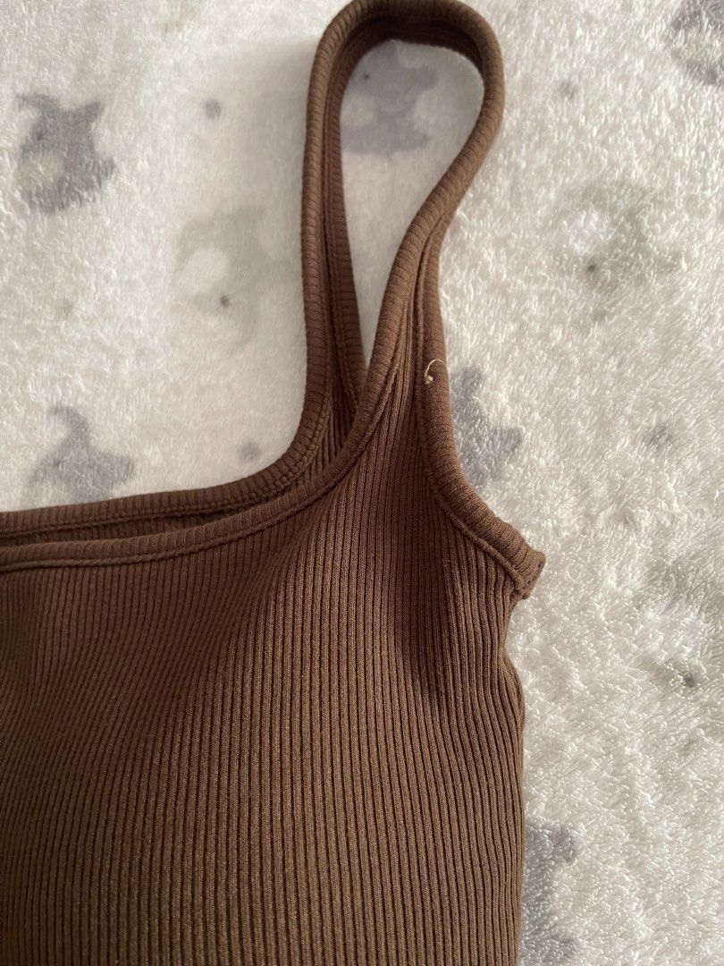 Milky Brown Ribbed Top with built-in bra (Category: Sleeveless) located in Sorsogon. Submitted by comfortbeforestyle (Listing ID 1470768320, Image 2). Description: Milky Brown Ribbed Top with Built-in Bra | XS–S | ₱280 Brand: Milky Bought for ₱400+ plus shipping. Selling for only ₱280. Super nice in actual! Washed once but never worn. As shown in the photos, the thread from where I removed the tag is still visible. Ribbed fabric with a built-in b