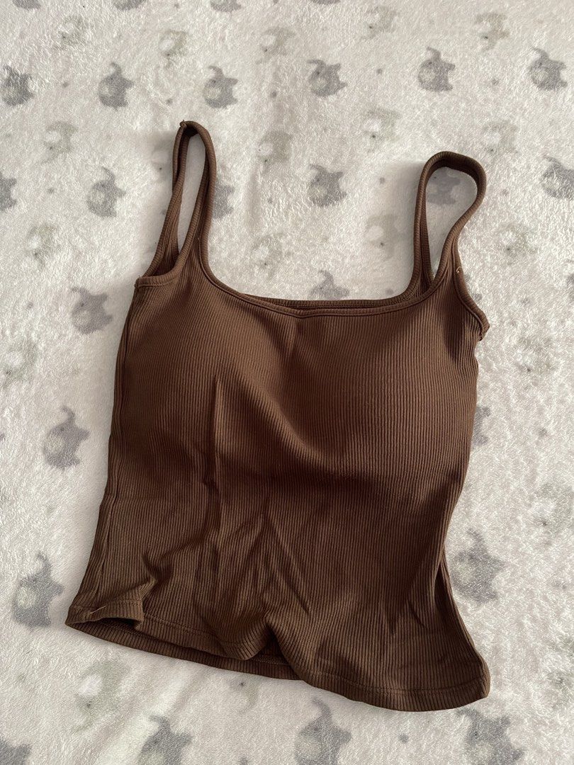 Milky Brown Ribbed Top with built-in bra (Category: Sleeveless) located in Sorsogon. Submitted by comfortbeforestyle (Listing ID 1470768320, Image 1). Description: Milky Brown Ribbed Top with Built-in Bra | XS–S | ₱280 Brand: Milky Bought for ₱400+ plus shipping. Selling for only ₱280. Super nice in actual! Washed once but never worn. As shown in the photos, the thread from where I removed the tag is still visible. Ribbed fabric with a built-in b