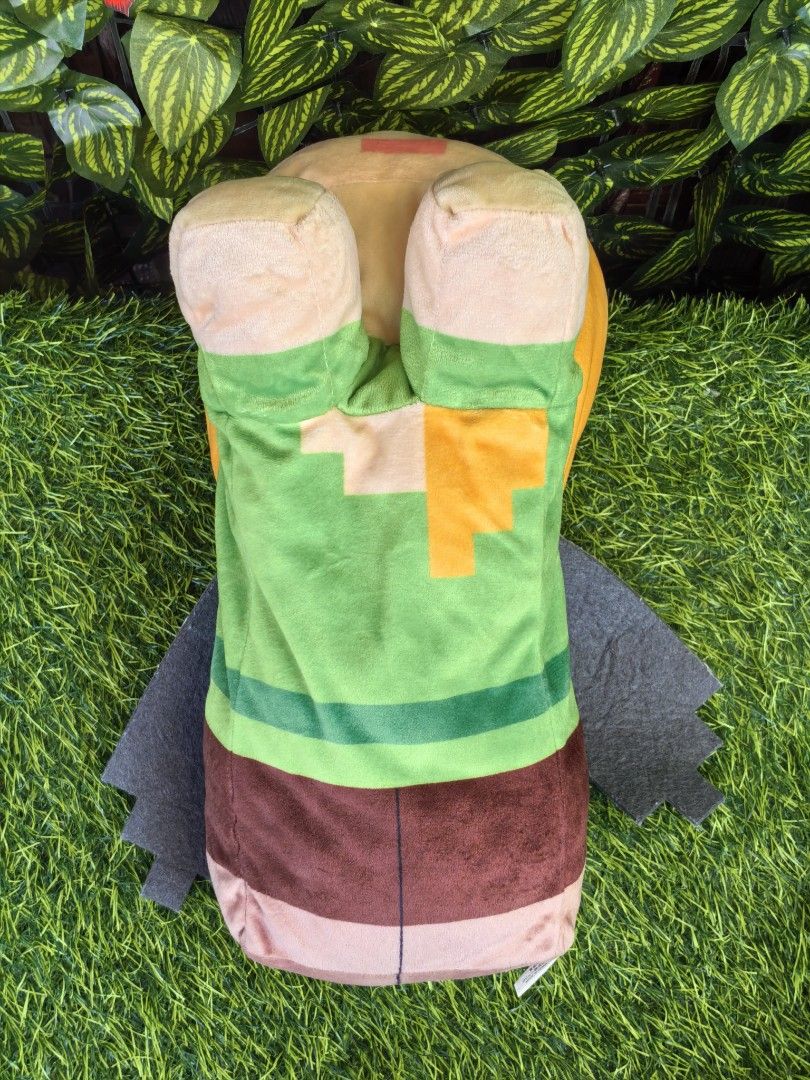 Minecraft Alex character plush soft toy doll approx 35cm (Category: Plushies & Soft Toys) located in Paranaque City. Submitted by furugiyafinds (Listing ID 1470792921, Image 3). Description: - Official Minecraft Alex plush toy with attached tag - Features iconic blocky head, green shirt, brown pants, and grey felt wings - Made with soft, high-quality fabric and detailed pixelated design - Clean condition, no tears, no stains - Perfect for gamer c