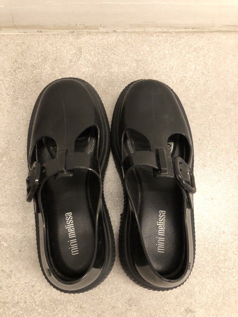 Mini Melissa Black Shoes (Category: Babies & Kids Fashion) located in Angeles City. Submitted by formomandbaby (Listing ID 1470860377, Image 3). Description: - Brand: Mini Melissa (Jackie Inf) - Color: Black - Size: 12 US / 32/33 EUR - Material: Soft, comfortable jelly - Design: T-bar with buckle strap and trendy chunky ridged sole - Inclusions: Original shoe box included - Condition: Excellent / As described - Perfect for stylish little ones!.