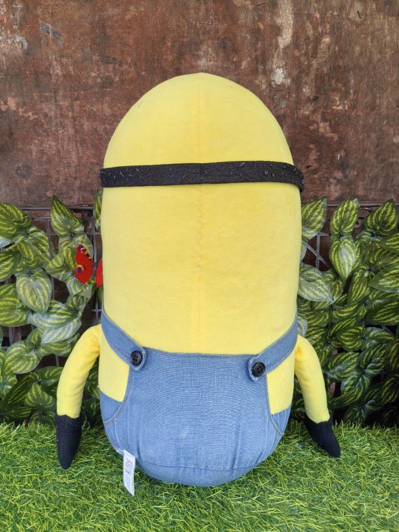 Minion Plush Toy Despicable Me 3 (Category: Plushies & Soft Toys) located in Paranaque City. Submitted by furugiyafinds (Listing ID 1470797241, Image 2). Description: - Official Despicable Me 3 Minion stuffed toy - Tall yellow plush design with embroidered facial details - Comes with classic fabric overalls, black gloves, and shoes - Clean and well-maintained fabric - Official branding tag attached at the back.