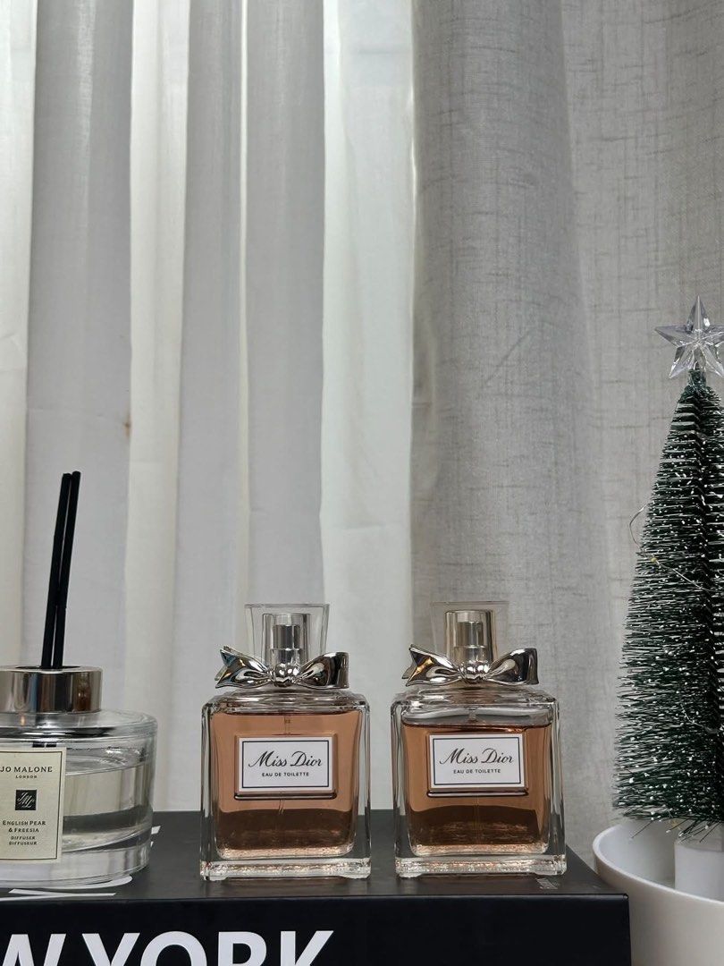 Miss Dior Eau De Toilette (Category: Fragrance & Deodorants) located in Leyte. Submitted by modernpersephone (Listing ID 1470815076, Image 1). Description: - Item: 2 bottles of Miss Dior Eau de Toilette - Scent: Classic floral, perfect for daily wear or going out - Condition: Full bottles with pinkish juice - Design: Features the iconic silver bow on top No box. Authentic, not tester. Left - P5650 Right - P5000.