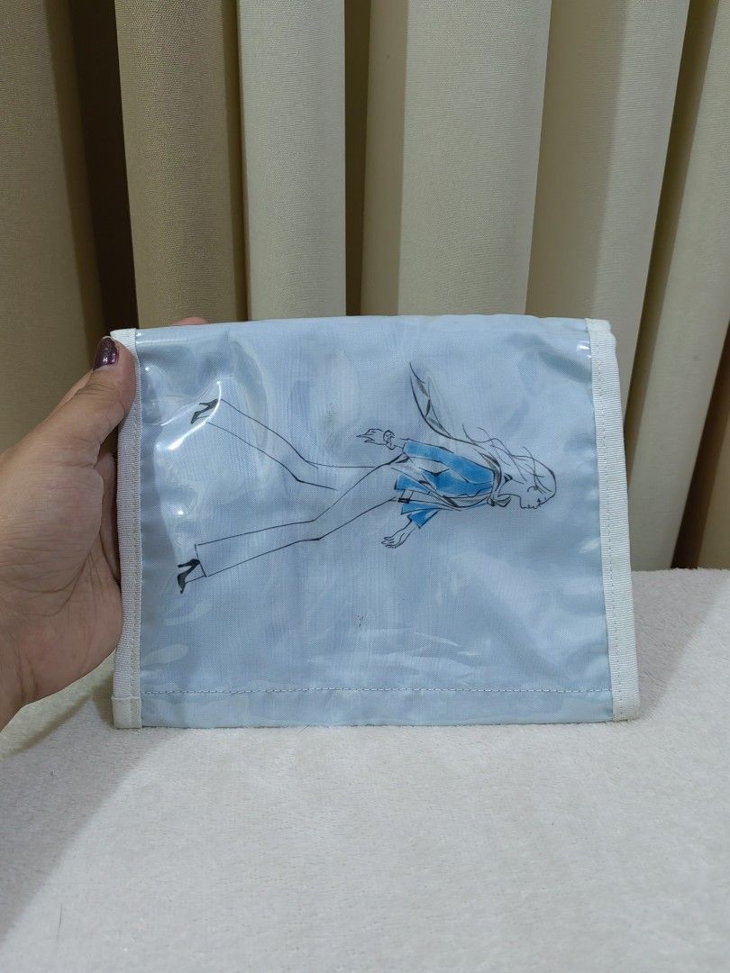 Mitsukoshi Light Blue Foldable Travel Organizer Toiletry Pouch (Category: Purses & Pouches) located in Makati City. Submitted by prelovedtreatedwithlove (Listing ID 1470896668, Image 3). Description: - Brand/Model: Authentic Mitsukoshi foldable travel pouch - Color: Light blue with a stylish fashion illustration print of a woman walking on the back - Closure: Front flap with secure velcro closure - Versatile Use: Compact size great for organizing