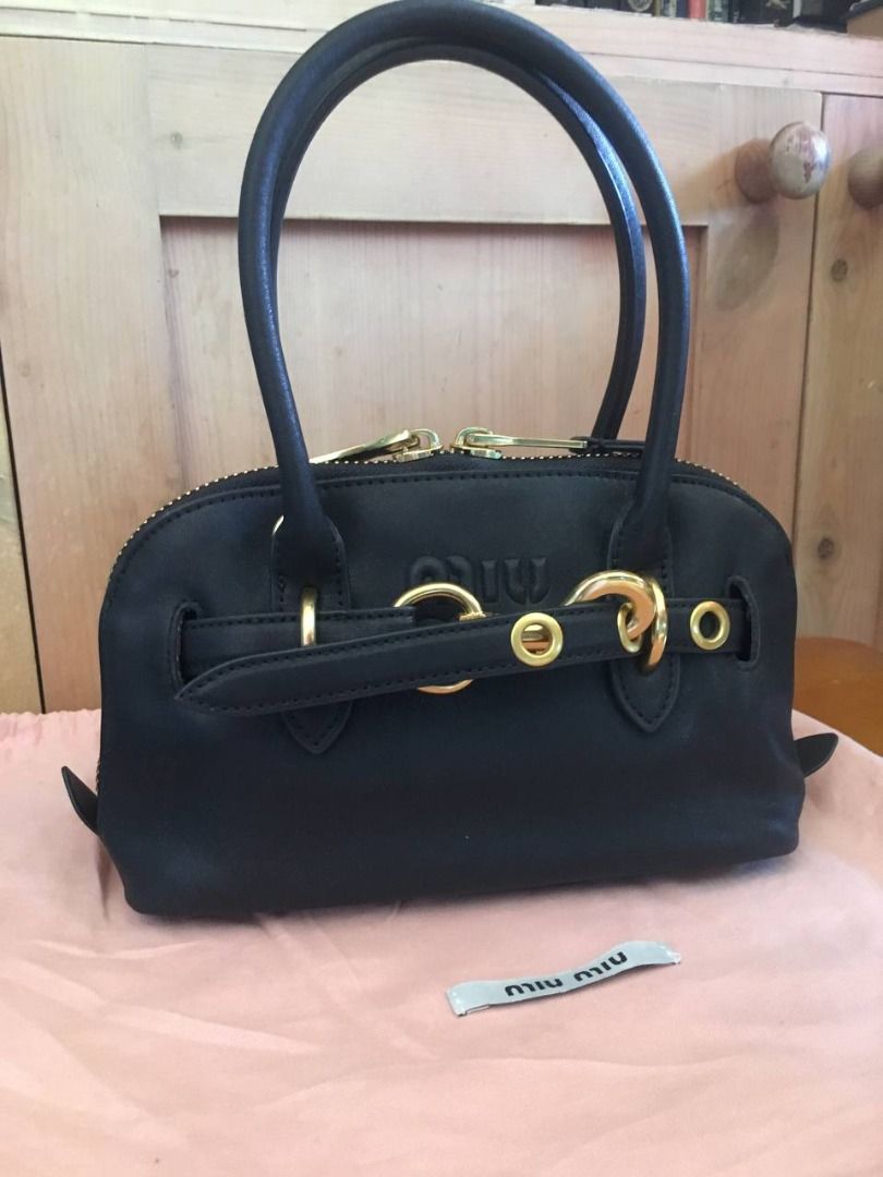 Miu Miu Aventure Mini Nappa Leather Bag (Category: Luxury Bags & Wallets) located in Cavite. Submitted by xtina_m (Listing ID 1470772782, Image 2). Description: Miu Miu Aventure Mini Bag - Source: Pre-owned by my Ate, dibs ko sa padala nya. - RFS: Doesn't fit my books or Kindle, barely used it. - Inclusions: Comes with original dust bag and strap - Condition: Excellent..