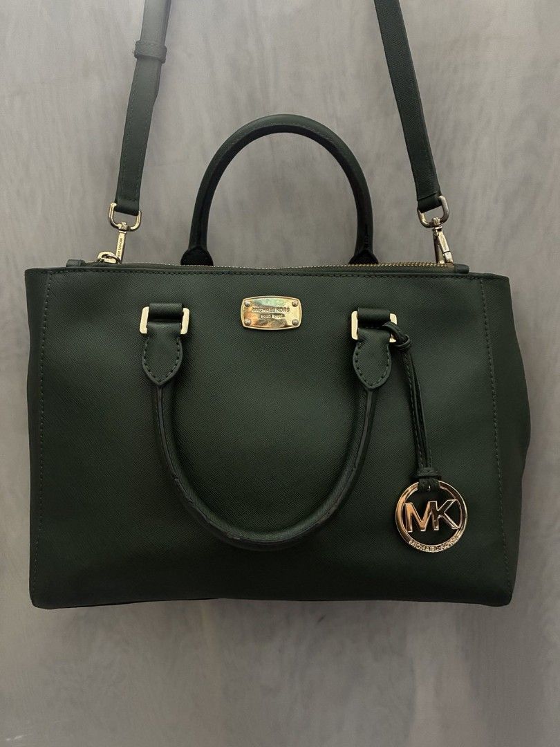 MK Handbag / cross body bag (Category: Cross-body Bags) located in Quezon City. Submitted by sortedstyle (Listing ID 1470925587, Image 1). Description: - Green MK Handbag - Size : Medium -Saffiano Leather - tarnished hardwares - normal dirt inside since preloved - minor rubs on handle rubber linings - with long sling - hangtag still gold.