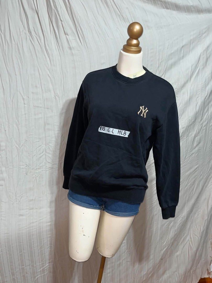 MLB New York Yankees Black Sweatshirt (Category: Coats, Jackets and Outerwear) located in General Trias. Submitted by crissy9053136 (Listing ID 1470761291, Image 1). Description: - Color: Classic Black - Brand/Team: Official MLB New York Yankees - Design: Small embroidered NY logo on left chest with a larger front graphic print and baseball bat details - Features: Round neckline, ribbed cuffs, and hem - Size: Labeled S to L - Condition: Great ove