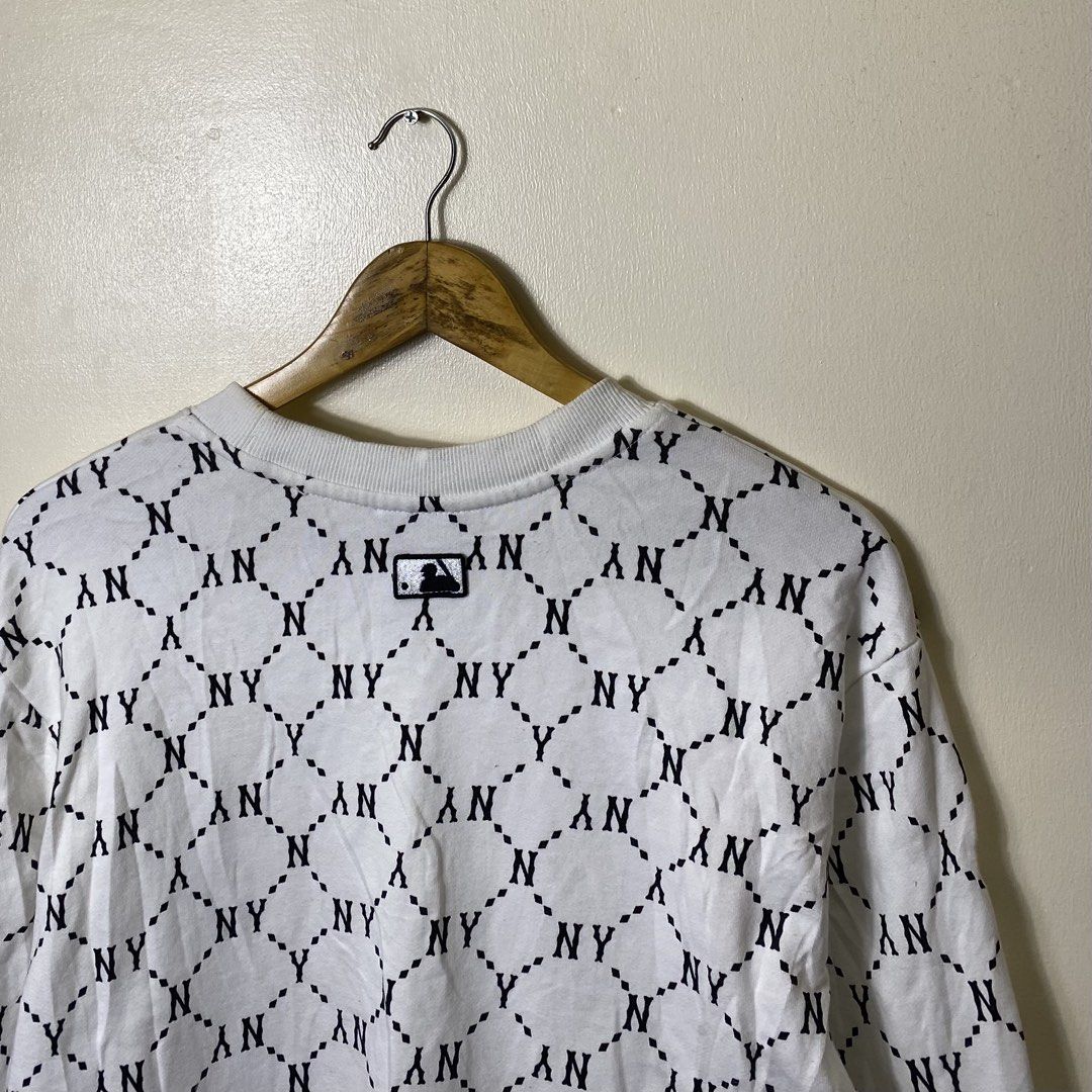 MLB New York Yankees Monogram Sweatshirt White XL (Category: Coats, Jackets and Outerwear) located in Cebu City. Submitted by theloose.thread (Listing ID 1470918521, Image 2). Description: - Brand: MLB New York Yankees - Item: Monogram Crewneck Sweatshirt - Size: XL - Color: Black and white all-over print - Details: Embroidered chest logo, ribbed cuffs, collar, and hem - Material: Cotton and polyester blend - Authenticity: Genuine merchandise tag