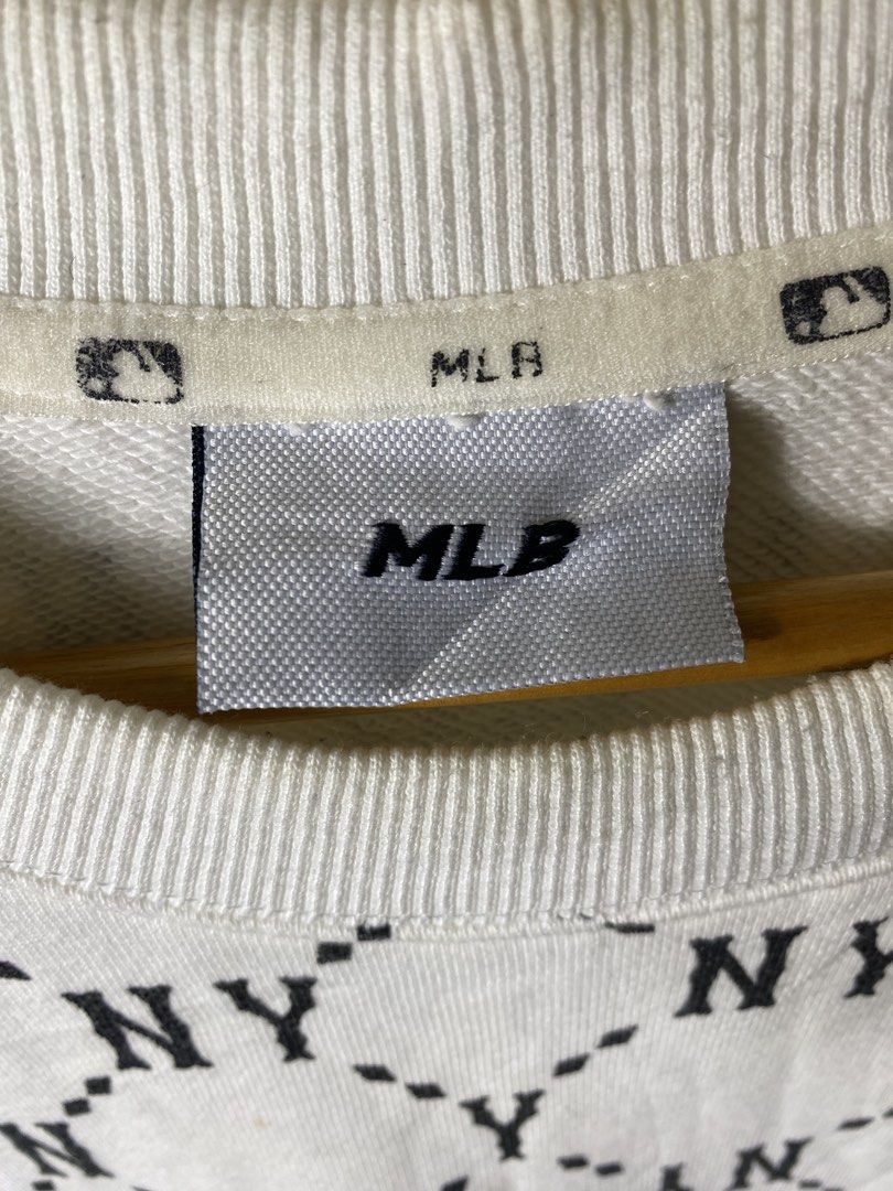 MLB New York Yankees Monogram Sweatshirt White XL (Category: Coats, Jackets and Outerwear) located in Cebu City. Submitted by theloose.thread (Listing ID 1470918521, Image 3). Description: - Brand: MLB New York Yankees - Item: Monogram Crewneck Sweatshirt - Size: XL - Color: Black and white all-over print - Details: Embroidered chest logo, ribbed cuffs, collar, and hem - Material: Cotton and polyester blend - Authenticity: Genuine merchandise tag
