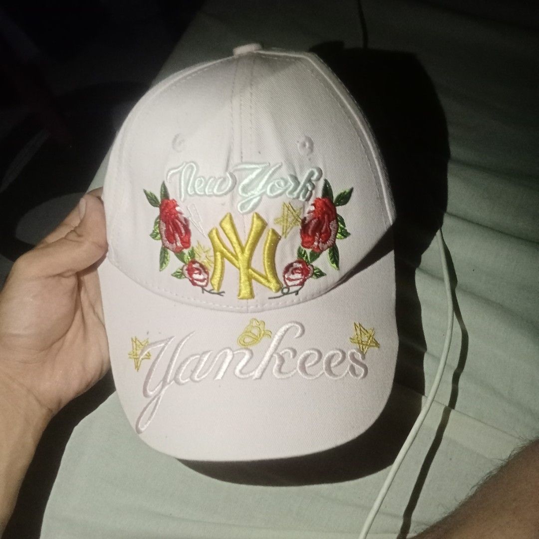 MLB Yankees pink Cap (Category: Caps & Hats) located in Manila. Submitted by oddearth.gerald (Listing ID 1470855319, Image 2). Description: - 100% authentic MLB New York Yankees cap in classic pink - Eye-catching embroidered floral details with a stylish gold NY front logo - Cool star graphics printed on the side - Adjustable strap at the back with official MLB branding tag - Need to reblock and snapback has a little stain - Mode of Payment: GCas