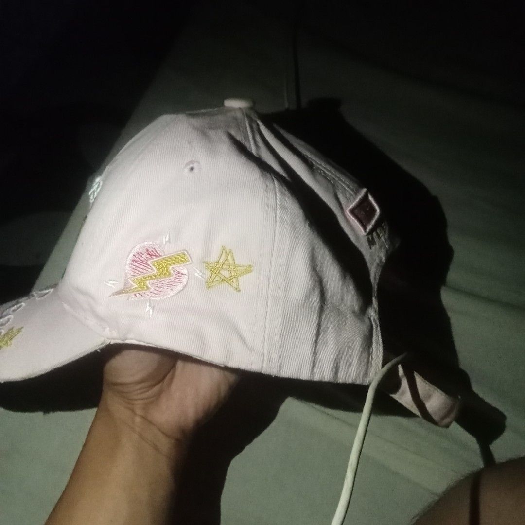 MLB Yankees pink Cap (Category: Caps & Hats) located in Manila. Submitted by oddearth.gerald (Listing ID 1470855319, Image 3). Description: - 100% authentic MLB New York Yankees cap in classic pink - Eye-catching embroidered floral details with a stylish gold NY front logo - Cool star graphics printed on the side - Adjustable strap at the back with official MLB branding tag - Need to reblock and snapback has a little stain - Mode of Payment: GCas