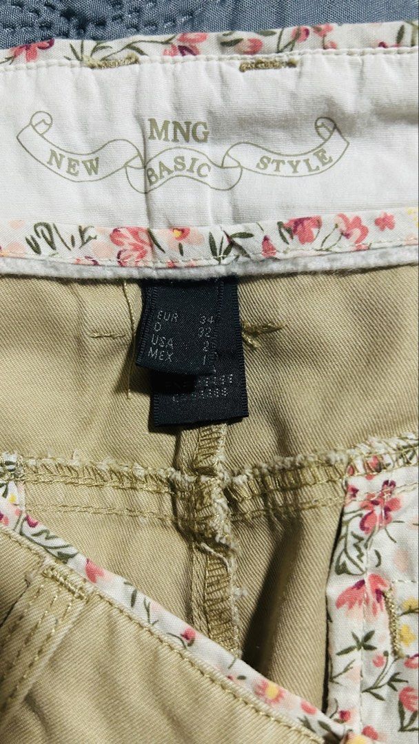 MNG Basic Style Khaki Floral Trim Cargo Skirt (Category: Skirts) located in Quezon City. Submitted by halfofit (Listing ID 1470746817, Image 3). Description: - Brand: MNG New Basic Style - Color: Khaki with floral fabric trim - Size: EUR 34 / USA 2 - Closure: Double button with zip fly - Pockets: Front slant pockets and back buttoned flap pockets - Extras: Includes belt loops - Condition: Great casual piece.