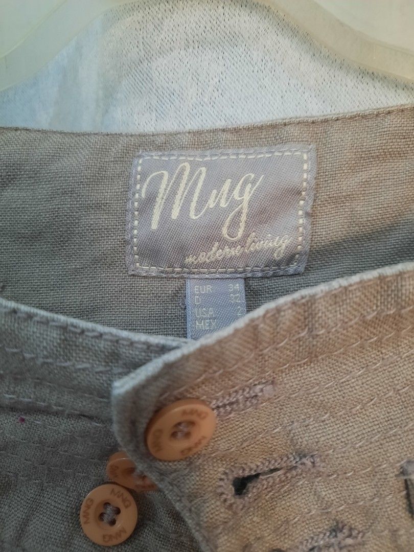 MNG Mango Khaki Capri Pants Size EUR 34 (Category: Jeans) located in Marilao. Submitted by mariealeiah (Listing ID 1470752632, Image 2). Description: - Brand/Model: MNG Mango Khaki Capri Pants - Size: EUR 34, USA 2 - Material: Lightweight fabric, ideal for warm weather - Design: Button closure with multiple front buttons, chic pleating near the waistband, and trendy rolled cuffs - Condition: Clean and well-maintained.
