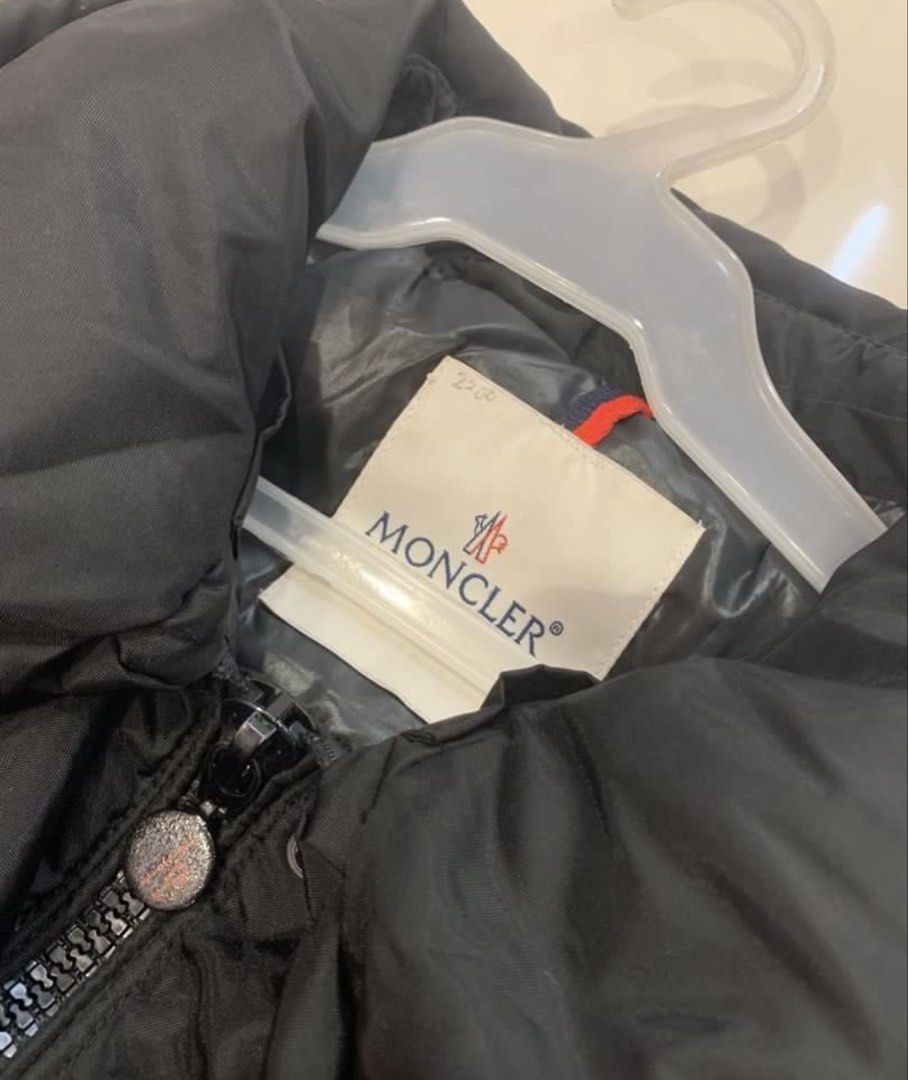 MONCLER Black Puffer Jacket with Belt (Category: Luxury Apparel) located in Manila. Submitted by ann_kia (Listing ID 1470902843, Image 3). Description: - Brand: Moncler - Item: Women's Puffer Jacket with Belt - Color: Classic Black - Size: Small (S) - Features: Matching waist belt for a flattering fit, high collar, branded metal snap buttons, and multiple front utility pockets - Details: Signature Moncler sleeve logo patch and iconic cartoon care