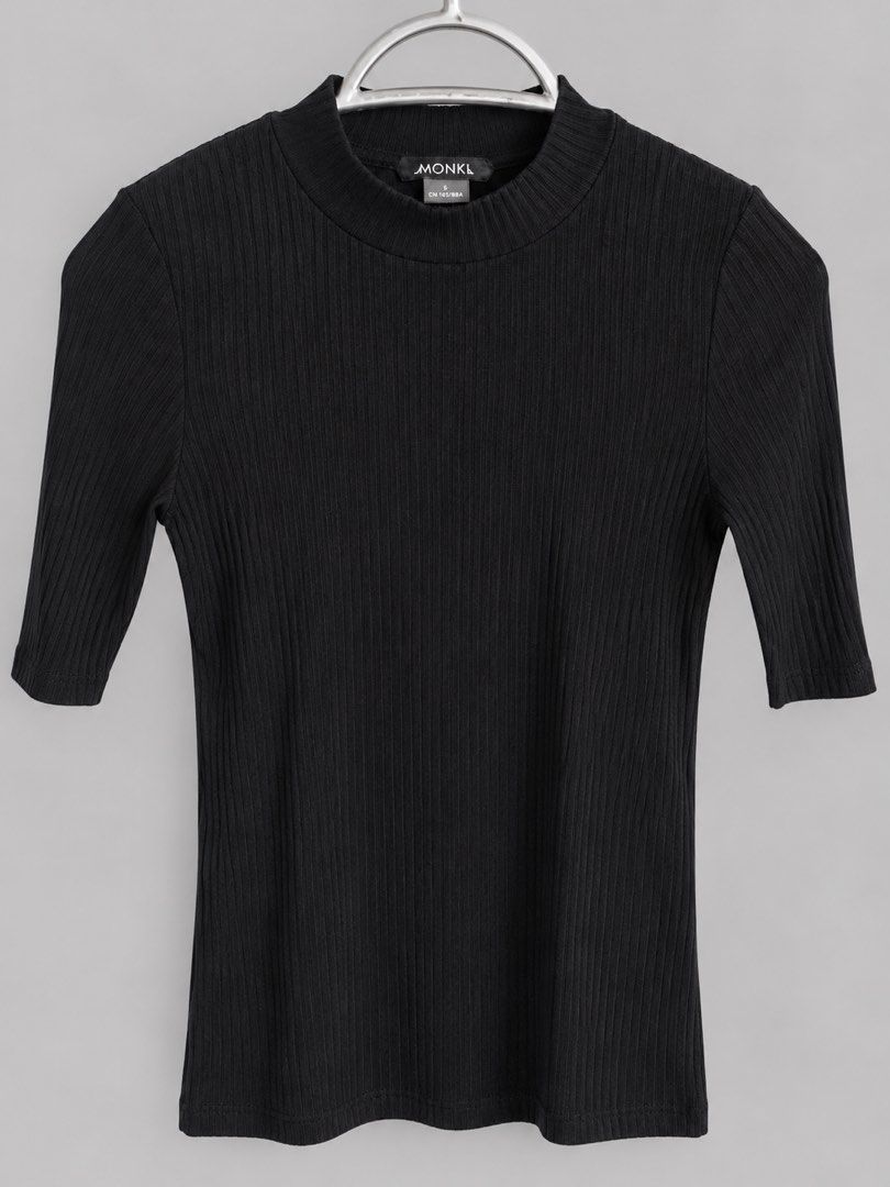 Monki Black Ribbed Mock Neck Top (Category: Sleeveless) located in Bacoor. Submitted by goodfinds02 (Listing ID 1470866018, Image 1). Description: - Brand: Monki - Color: Solid black - Size: S (tag attached near the collar) - Design: Mock neckline with short sleeves - Fit: Fitted silhouette - Versatility: Perfect for layering or wearing solo with jeans.