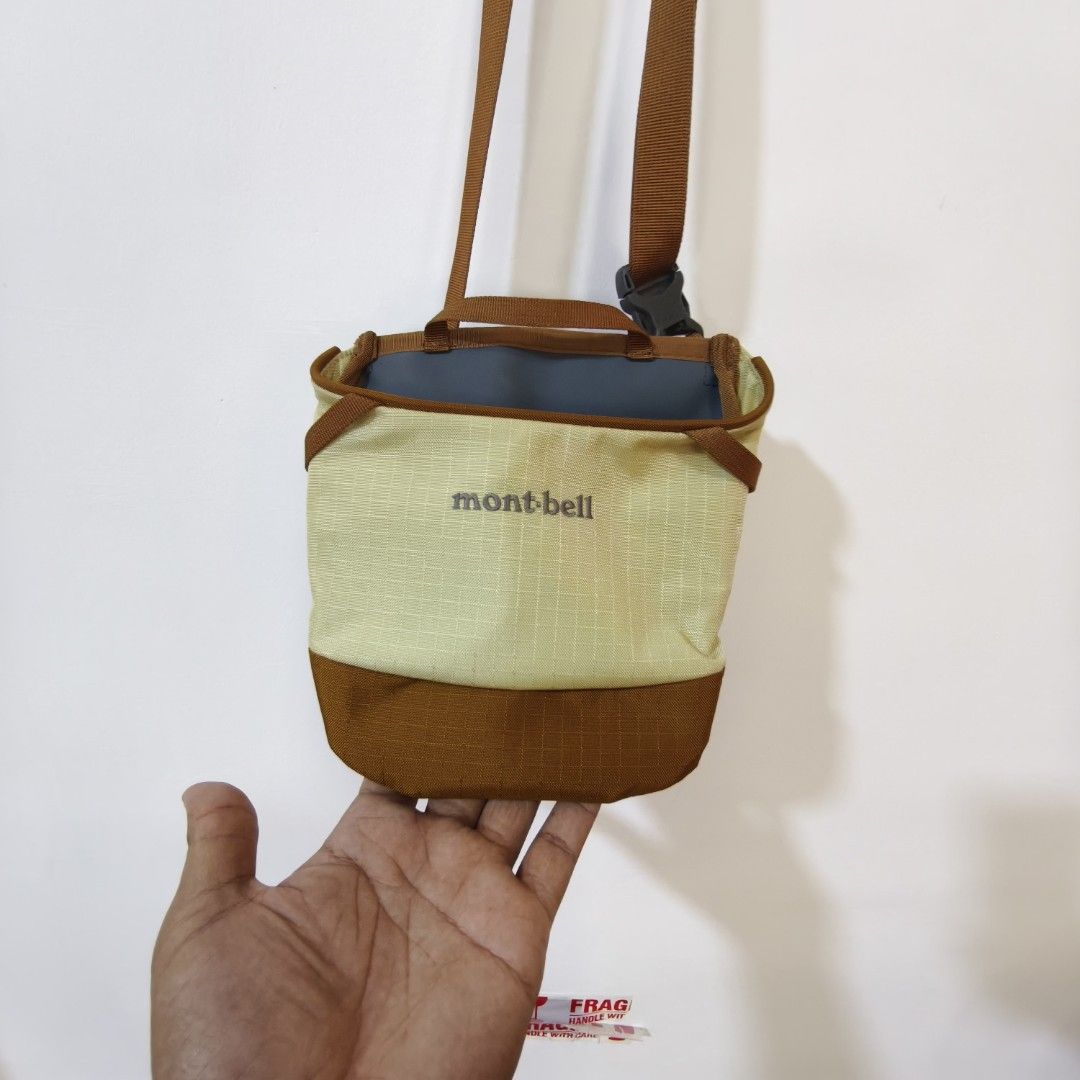 Mont-bell Field Tool Pouch S (Category: Belt bags, Clutches and Pouches) located in Quezon City. Submitted by inrelationthrift (Listing ID 1470826905, Image 2). Description: - Brand: Mont-bell - Color: Khaki and brown - Strap: Adjustable brown shoulder strap with secure plastic buckle closure - Interior: Includes slip pockets for easy organization - Origin: Made in Vietnam (Tag No. 431542401) - Best for: Outdoor trips, hikes, or casual everyday c