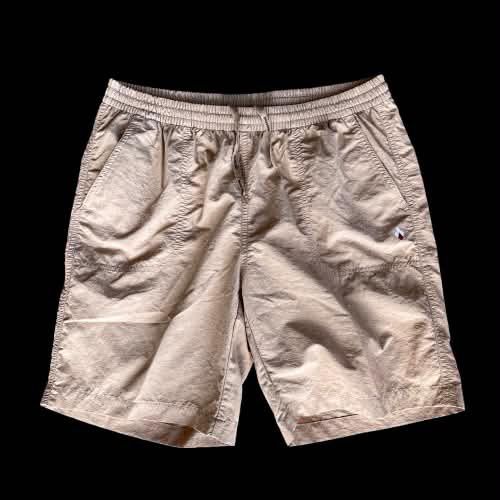Mont-Bell khaki shorts (Category: Tshirts & Polo Shirts ) located in Caloocan City. Submitted by landcruiser76__ (Listing ID 1470875457, Image 1). Description: - Brand: Mont-Bell - Color: Khaki - Size: 73 - Waist: Elastic waistband with adjustable drawstring - Features: Branded string, back button flap pocket, and embroidered logo detail on the leg - Condition: Excellent pre-owned condition - Perfect for casual wear and outdoor activities Conditi