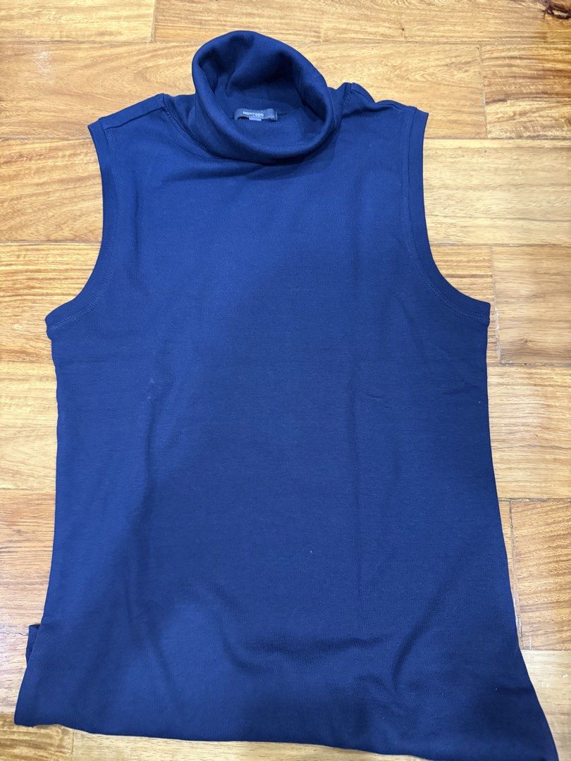 Montego Blue Sleeveless Turtleneck Top Size S (Category: Sleeveless) located in Taguig. Submitted by bau375 (Listing ID 1470893203, Image 1). Description: - Brand: Montego - Color: Navy blue - Size: S - Style: Sleeveless turtleneck basic top - Details: Ribbed knit material around the collar and armholes - Condition: Excellent, easy to layer or wear on its own.