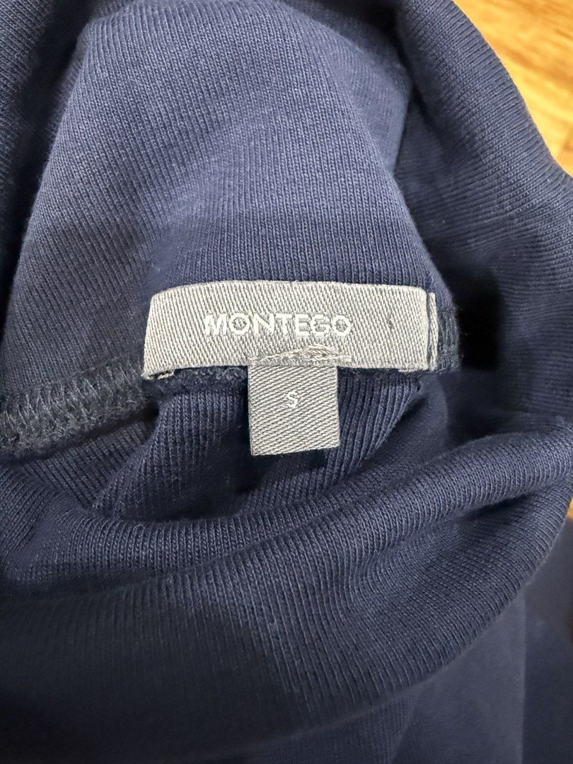 Montego Blue Sleeveless Turtleneck Top Size S (Category: Sleeveless) located in Taguig. Submitted by bau375 (Listing ID 1470893203, Image 2). Description: - Brand: Montego - Color: Navy blue - Size: S - Style: Sleeveless turtleneck basic top - Details: Ribbed knit material around the collar and armholes - Condition: Excellent, easy to layer or wear on its own.