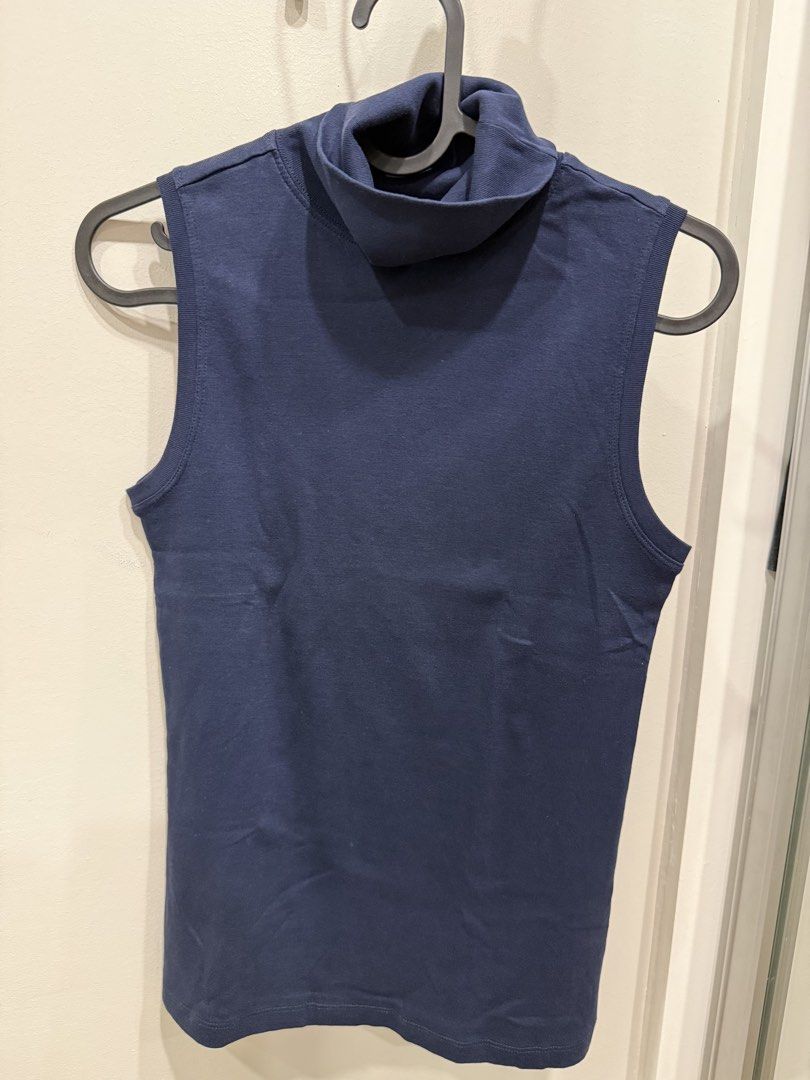 Montego Blue Sleeveless Turtleneck Top Size S (Category: Sleeveless) located in Taguig. Submitted by bau375 (Listing ID 1470893203, Image 3). Description: - Brand: Montego - Color: Navy blue - Size: S - Style: Sleeveless turtleneck basic top - Details: Ribbed knit material around the collar and armholes - Condition: Excellent, easy to layer or wear on its own.