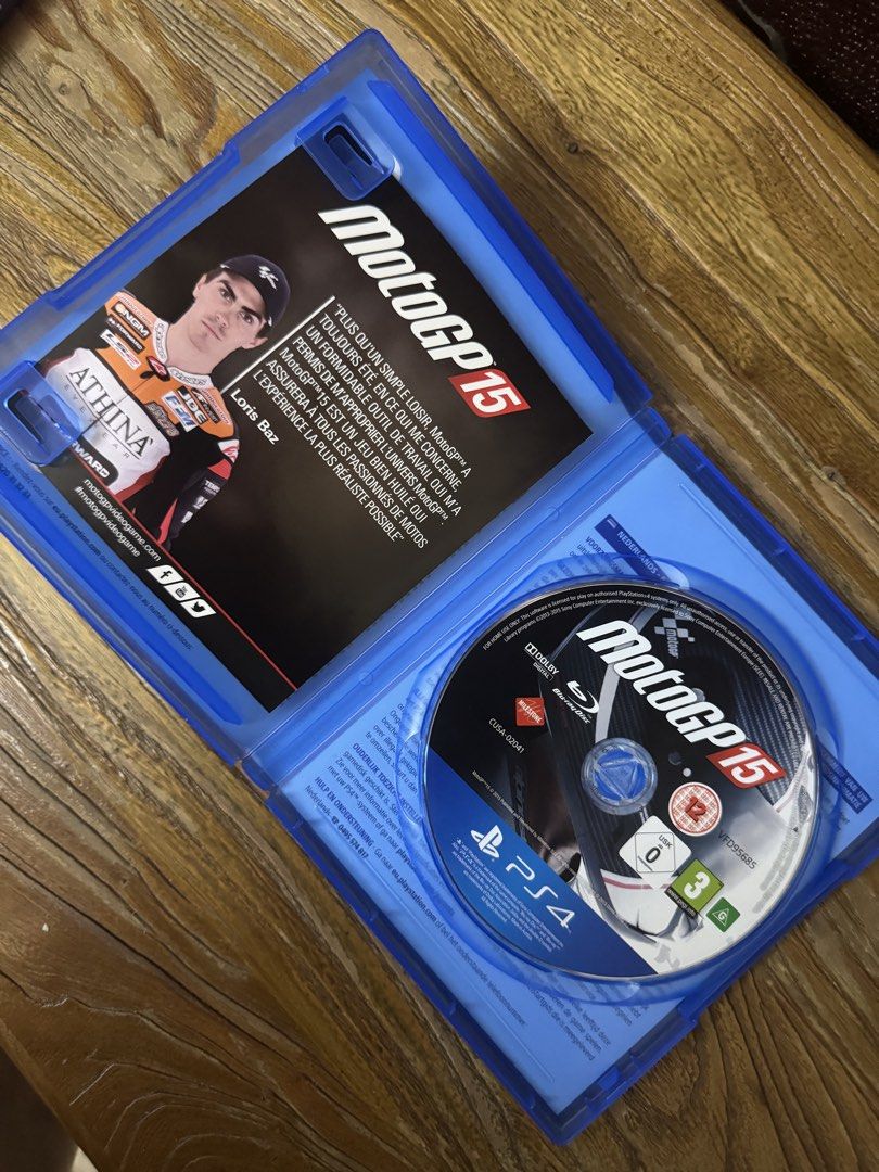 MotoGP 15 PS4 Game (Category: PlayStation) located in Las Pinas. Submitted by emdjss (Listing ID 1470804543, Image 2). Description: - Platform: PlayStation 4 (PS4) - Condition: Great shape, includes both original case and disc - Game Modes: Single-player, career mode, and online multiplayer - Special Features: Real historical events and realistic motorcycle racing physics - Rating: PEGI 3 (Note: Packaging features French and Dutch text).