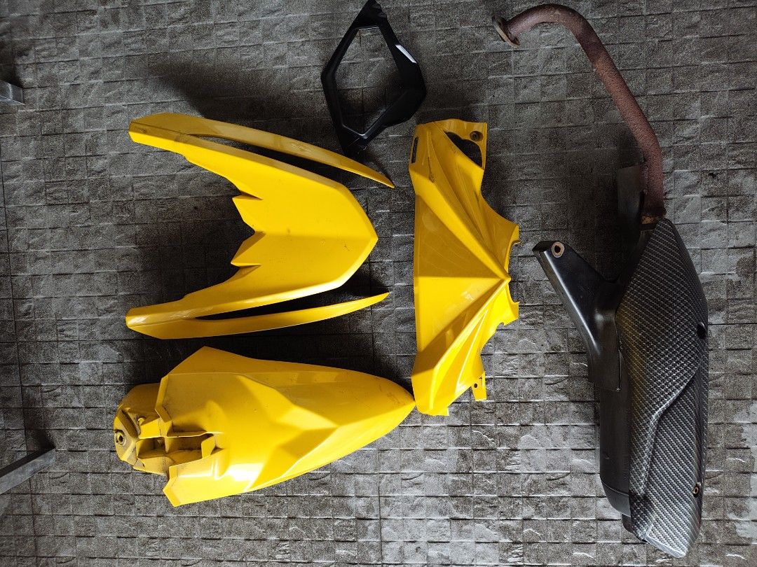 Motorcycle Fairings Set and Exhaust Pipe (Category: Body Parts and Accessories) located in Pasig City. Submitted by shane0315 (Listing ID 1470750789, Image 1). Description: - Complete scooter upgrade bundle - Includes yellow body panels, front fender, and headlight bezel - Comes with stock exhaust pipe, carbon fiber style heat shield, and header pipe - Sold as a full set only - Pickup preferred due to item size - PM for inquiries and location.