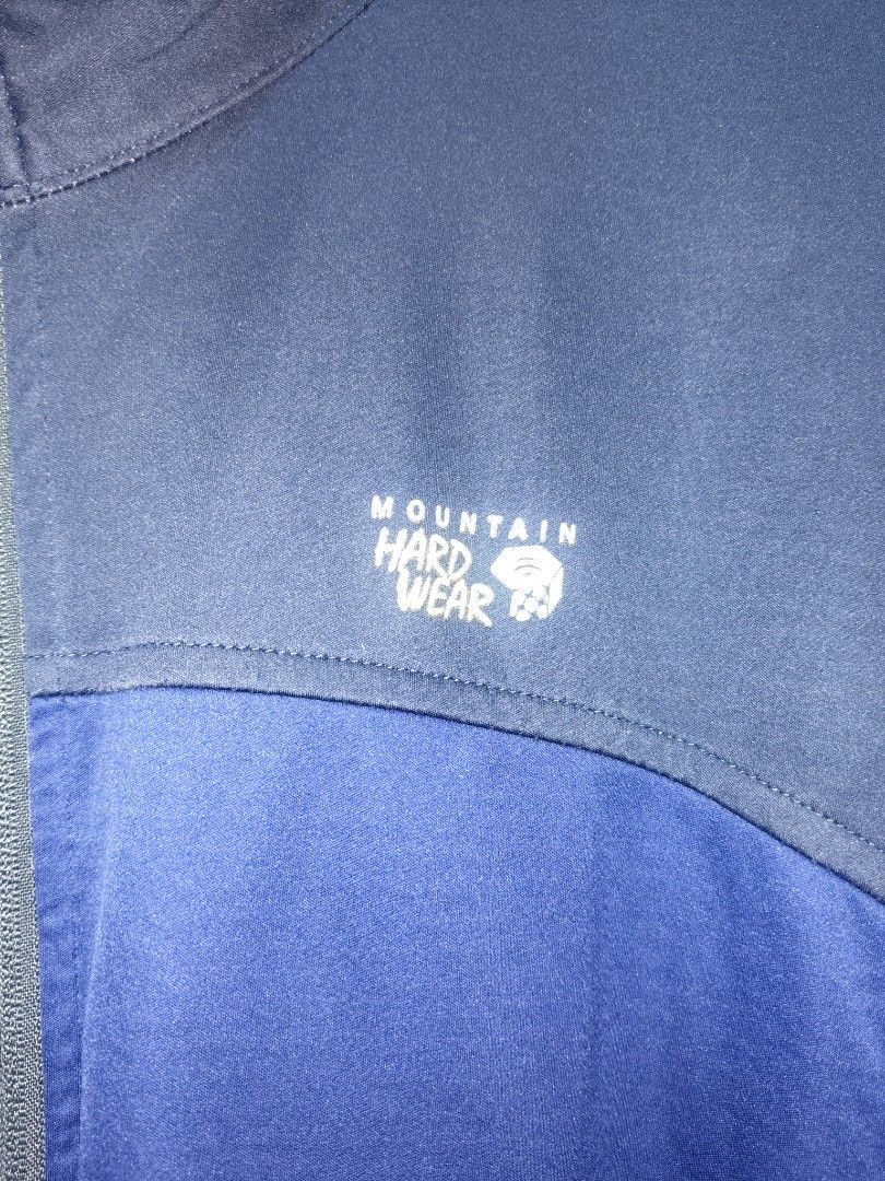 Mountain Hardwear Blue Softshell Jacket XL (Category: Coats, Jackets and Outerwear) located in San Juan City. Submitted by swiftfox.62e2f4 (Listing ID 1470766046, Image 2). Description: - Brand: Mountain Hardwear - Type: Softshell Jacket - Color: Blue and Navy - Size: XL - Features: Full zip front, two zippered hand pockets, high collar, long sleeves - Performance: Wind-resistant outer fabric with a warm interior lining - Condition: Excellent out