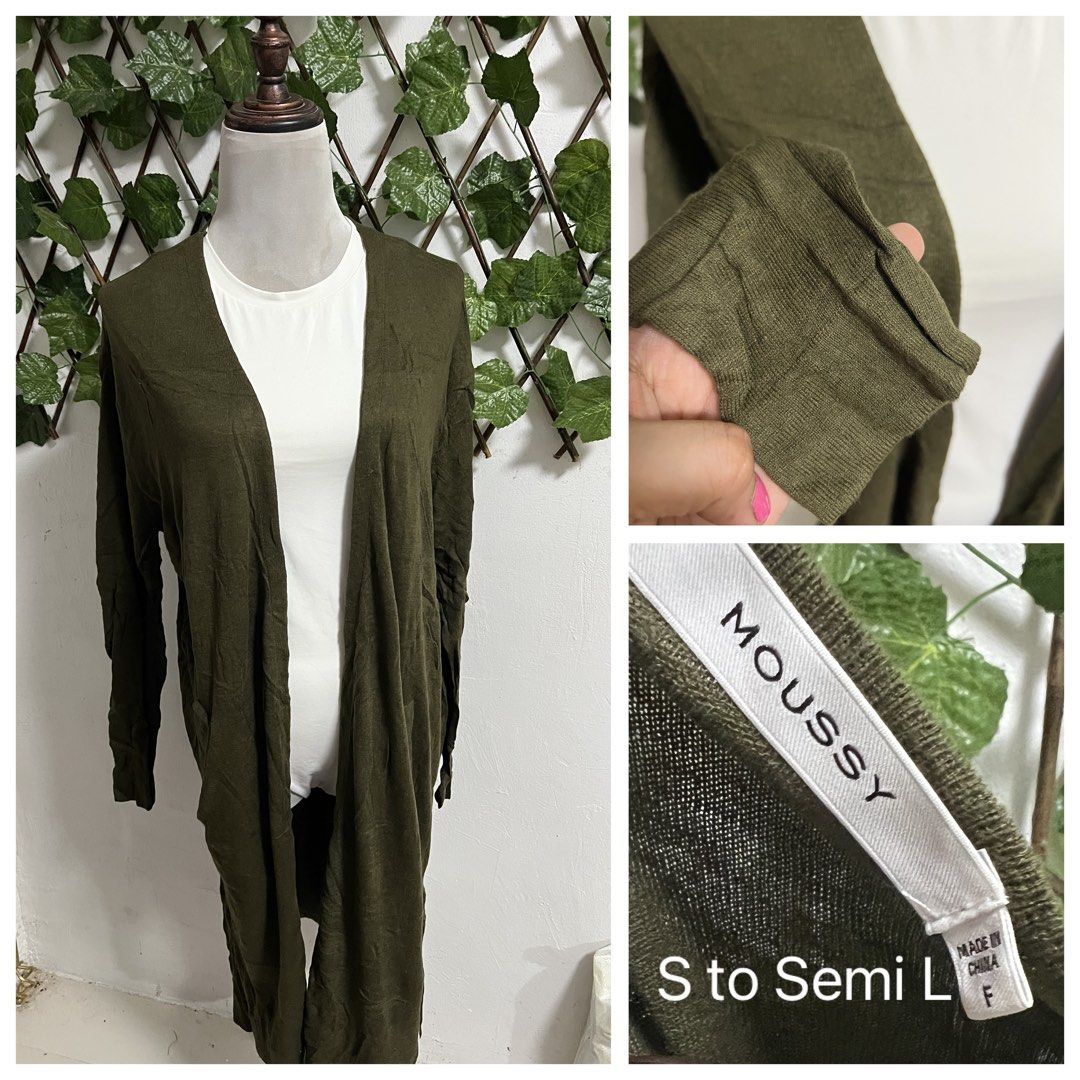 Moussy Olive Green Long Cardigan (Category: Coats, Jackets and Outerwear) located in Imus. Submitted by yshamel (Listing ID 1470747463, Image 1). Description: - Brand: Moussy - Color: Olive green (Earthy tone) - Style: Open front, long cardigan, lightweight knit - Features: Fitted cuffs - Size: Tagged F (Best fits Small to semi-Large) - Condition: Great for layering over basic tops.