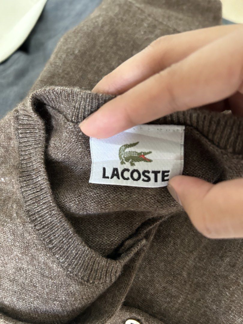 Lacoste Cardigan Sweater Brown Size S (Category: Coats, Jackets and Outerwear) located in Bacolod City. Submitted by gilbertgon94115 (Listing ID 1470787721, Image 2). Description: - Color: Brown - Size: S - Dimes: Width 16; Length 21 - Material: 70% wool, 30% yak blend (super soft) - Details: Long sleeves, ribbed collar trim - Origin: Made in Cambodia - Care: Standard care instructions on inner tag.