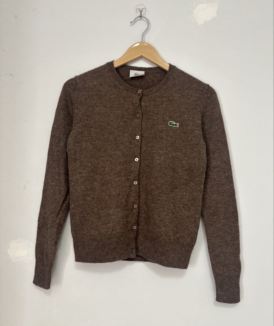 Lacoste Cardigan Sweater Brown Size S (Category: Coats, Jackets and Outerwear) located in Bacolod City. Submitted by gilbertgon94115 (Listing ID 1470787721, Image 1). Description: - Color: Brown - Size: S - Dimes: Width 16; Length 21 - Material: 70% wool, 30% yak blend (super soft) - Details: Long sleeves, ribbed collar trim - Origin: Made in Cambodia - Care: Standard care instructions on inner tag.