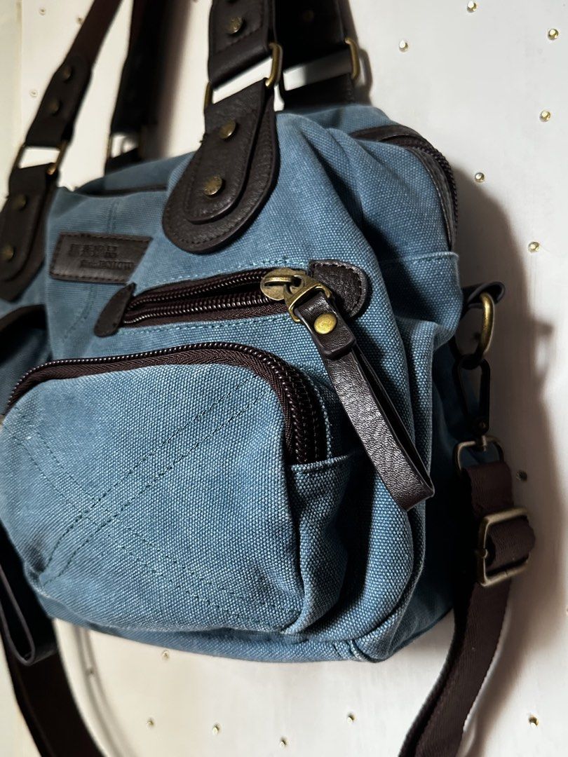 Multi pocket denim canvas satchel Bag (Category: Shoulder Bags) located in Cavite. Submitted by chicfinds.slay (Listing ID 1470831521, Image 2). Description: ✨2way bag very convenient spacious bag ✨can fit foldable umbrella,ipad,tumbler ✨no flaws all working zip y2k vibe bag w/etra strap ✨japan source ✨quality bag ✨cleaned & sanitized.