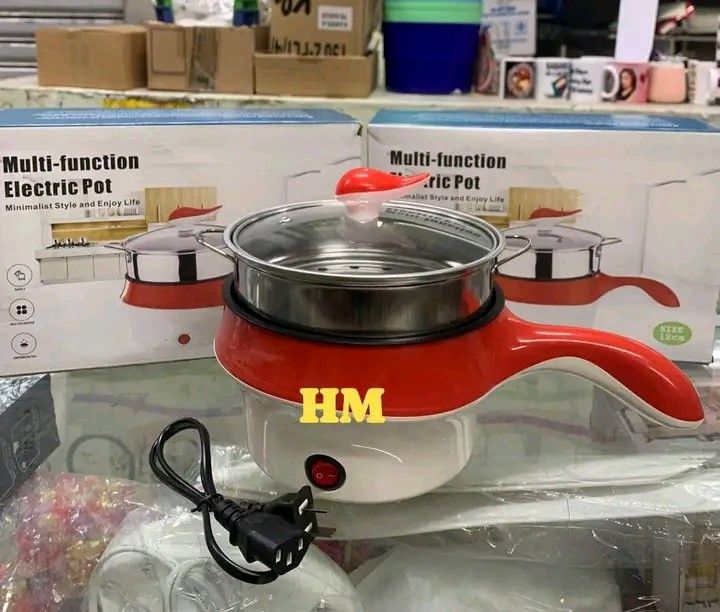 Multi-Function Electric Pot Cooker with Steamer Tray (Category: Cookers) located in Quezon City. Submitted by marecel146 (Listing ID 1470840735, Image 3). Description: - Color: Charming light blue and white - Versatile: Great for quick cooking, boiling, and steaming - Convenient: Cook small meals right at your dining table - Easy to Use: Simple front switch operation - Inclusions: Glass lid, steamer insert, power cord, and original box.