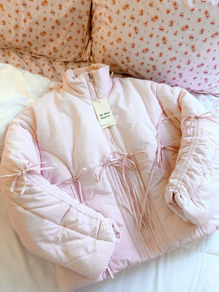 Mum Made It Pink Puffer Jacket with Bows (Category: Coats, Jackets and Outerwear) located in Makati City. Submitted by another_wear (Listing ID 1470800288, Image 3). Description: Brand new and never worn! This is really the cutest winter puffer jacket! Perfect for ballet core looks while being protected from the cold. Size XS but oversized fit so I would say this could fit up to M. I forgot the original price already but I think it was around 10K