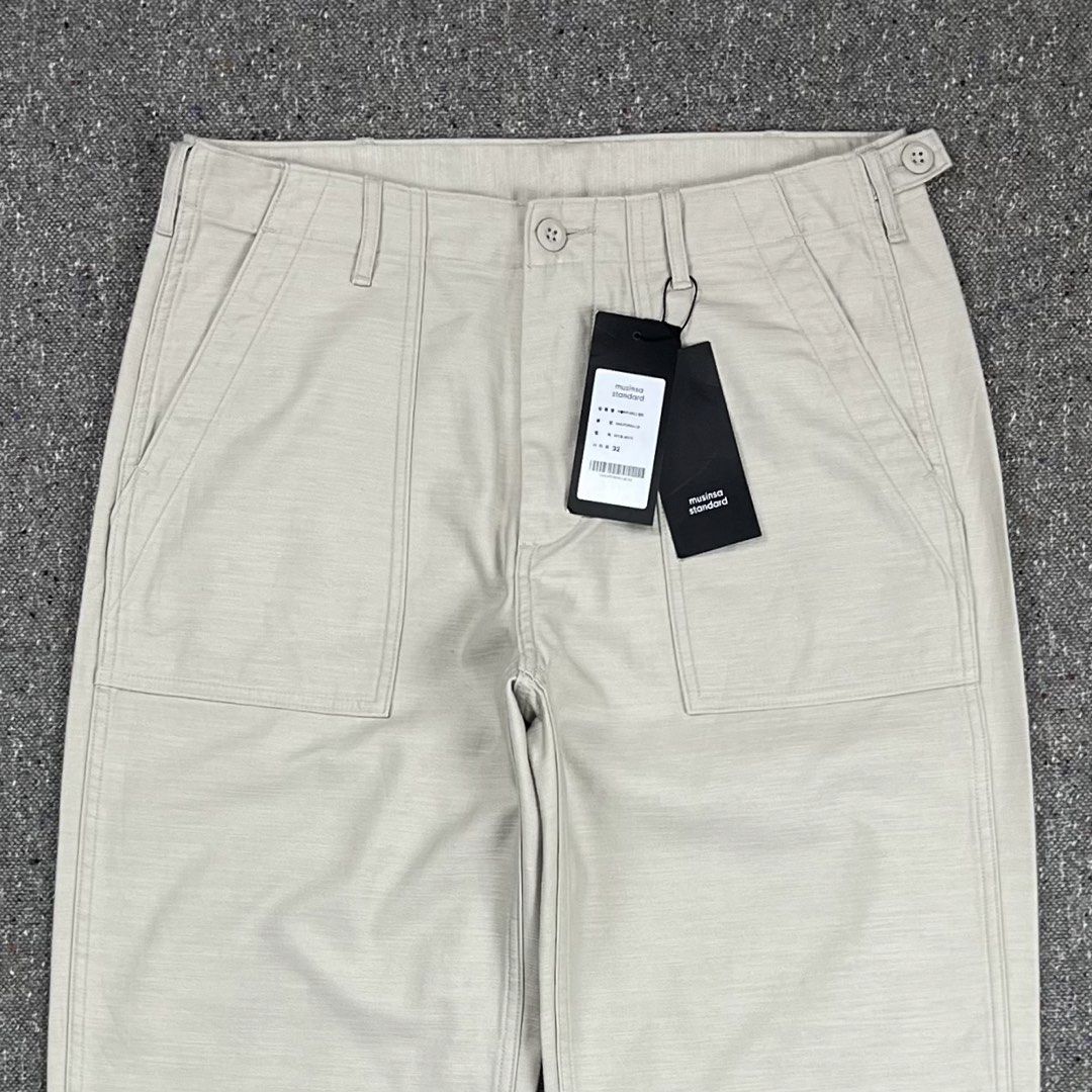 Musinsa standard type II Off-White fatigue Baker Pants (Category: Trousers) located in Zamboanga. Submitted by rag_20 (Listing ID 1470912321, Image 2). Description: Musinsa standard type II Off-White fatigue Baker Pants a pair of off-white or neutral cotton utility/fatigue trousers with front and back patch pockets and adjustable on the waistband. These classic military-inspired utility pants commonly referred to as baker pant feature distinct fr