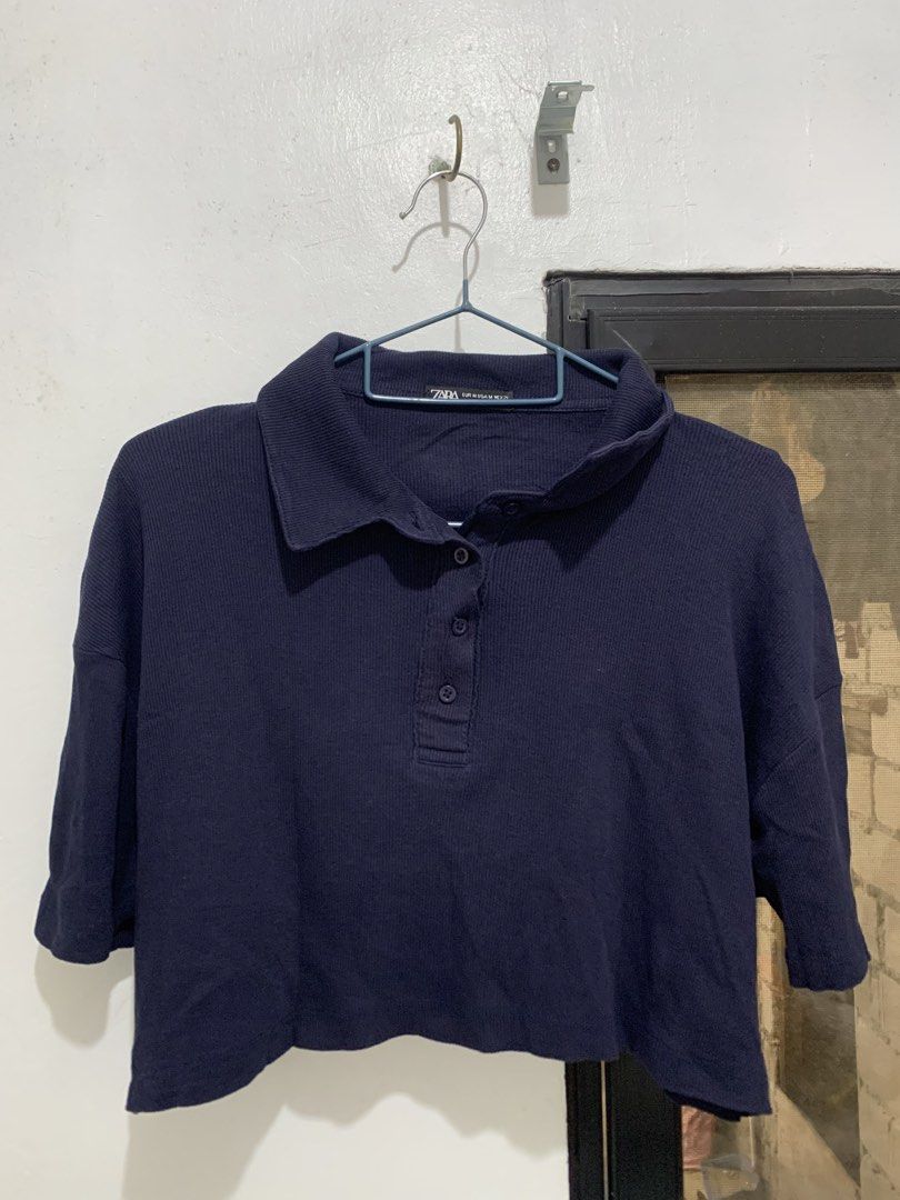 Navy Blue Ribbed Cropped Polo Shirt (Category: Blouses) located in Caloocan City. Submitted by jjasss.mn_ (Listing ID 1470752805, Image 1). Description: Loose fit silhouette and a four button placket. Best pair with fitted jeans. Casual and formal attire.