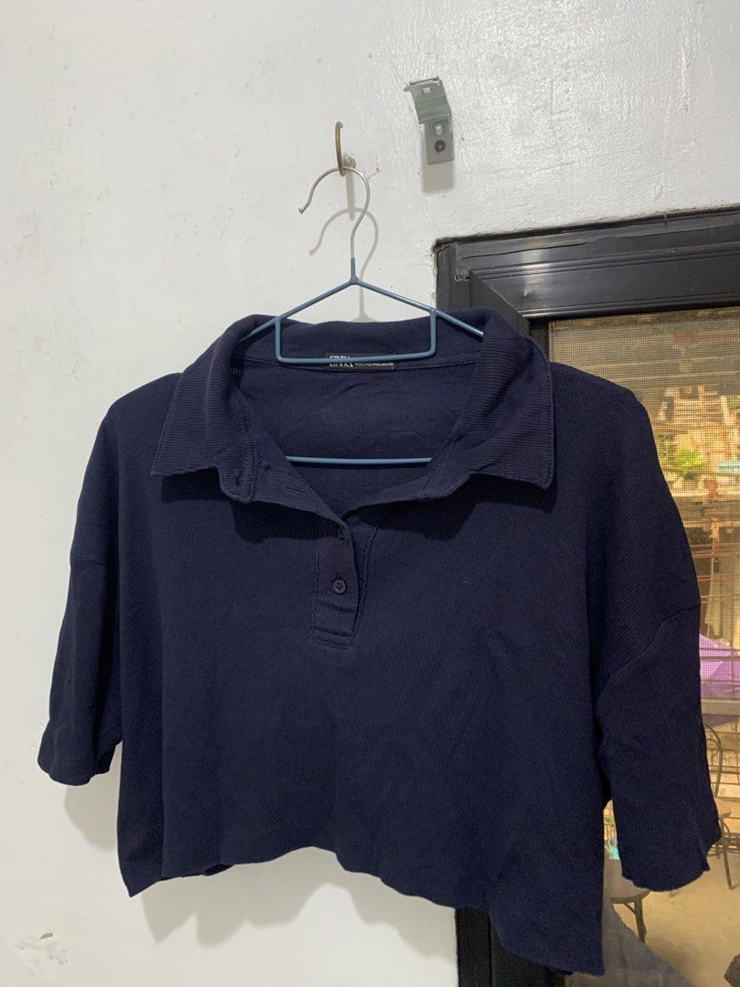 Navy Blue Ribbed Cropped Polo Shirt (Category: Blouses) located in Caloocan City. Submitted by jjasss.mn_ (Listing ID 1470752805, Image 3). Description: Loose fit silhouette and a four button placket. Best pair with fitted jeans. Casual and formal attire.