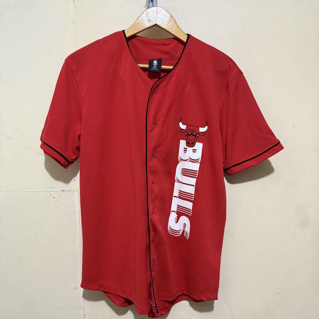 NBA Chicago Bulls Red Baseball Jersey Size (Category: Activewear) located in Quezon City. Submitted by retroworldph (Listing ID 1470865287, Image 1). Description: NBA Chicago Bulls Button Down Jersey w/ back print. Very good condition 26 front length 29 back length 19.5 width ₱750 .