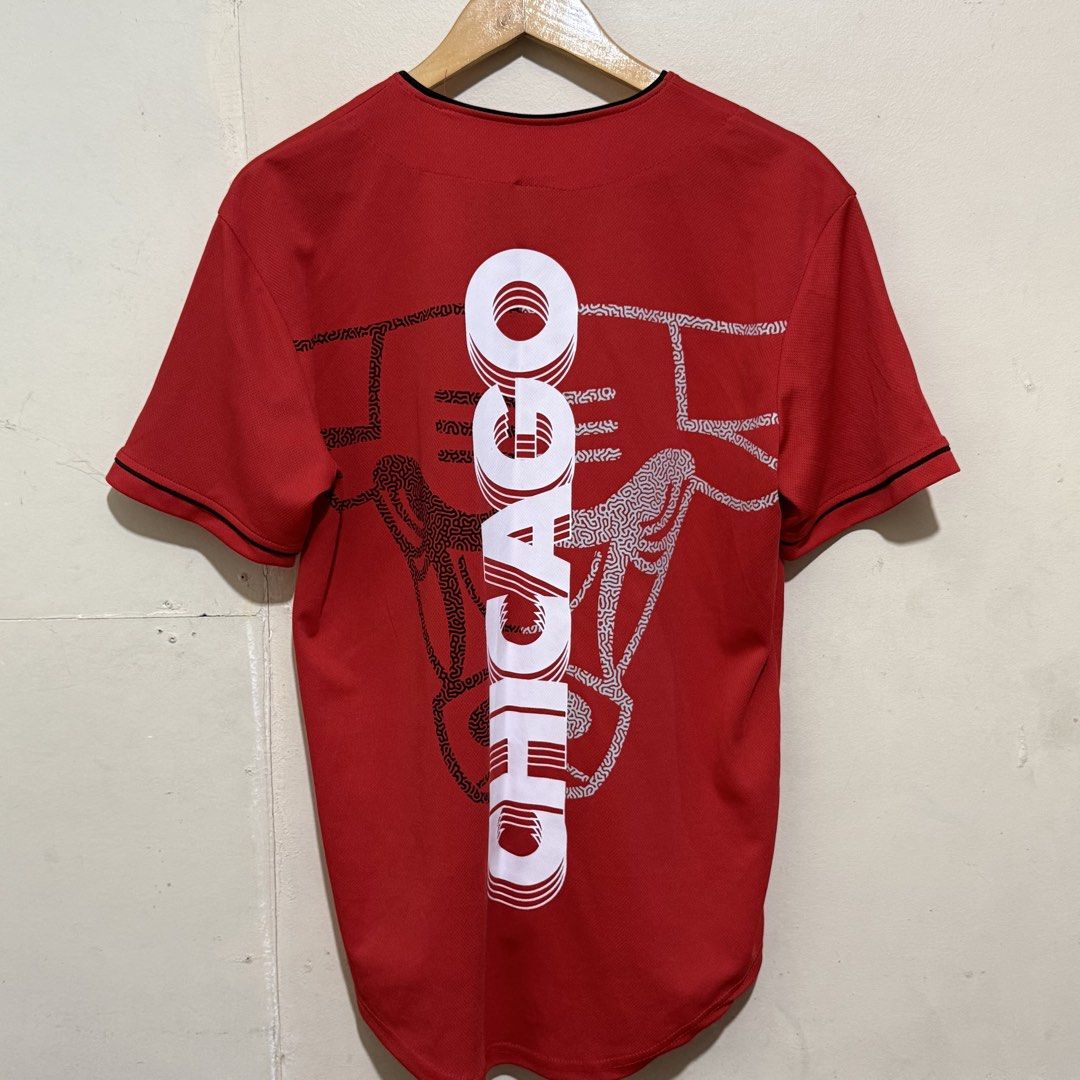 NBA Chicago Bulls Red Baseball Jersey Size (Category: Activewear) located in Quezon City. Submitted by retroworldph (Listing ID 1470865287, Image 2). Description: NBA Chicago Bulls Button Down Jersey w/ back print. Very good condition 26 front length 29 back length 19.5 width ₱750 .