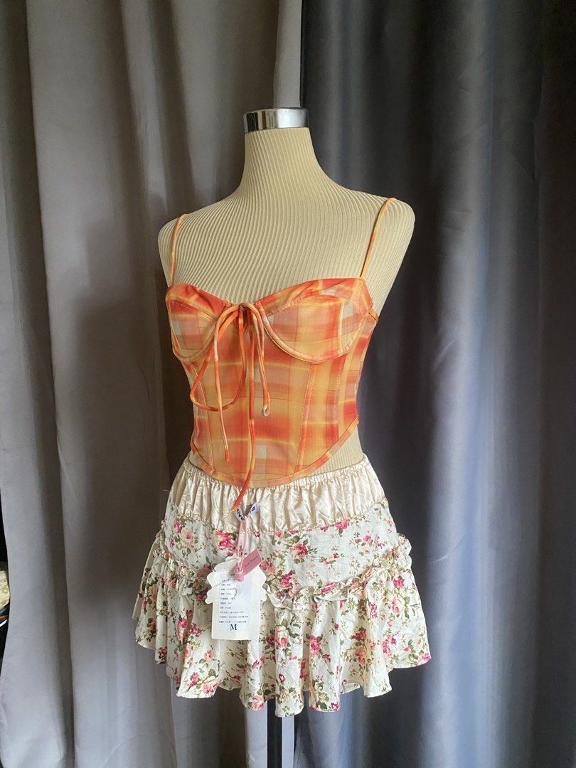 Neon Hart Orange Viccy Check Mesh Corset Cami Top (Category: Sleeveless) located in Cagayan de Oro. Submitted by curated_closetph (Listing ID 1470746607, Image 2). Description: — Size: XS - S — Color: Orange / Yellow Plaid — Lightweight sheer mesh overlay fabrication — Sweetheart neck with fixed thin cami straps — Front criss-cross tie detailing — Pointed asymmetrical hem — Exposed center back zipper closure — Can negotiate the price — 🛒 Shop mo