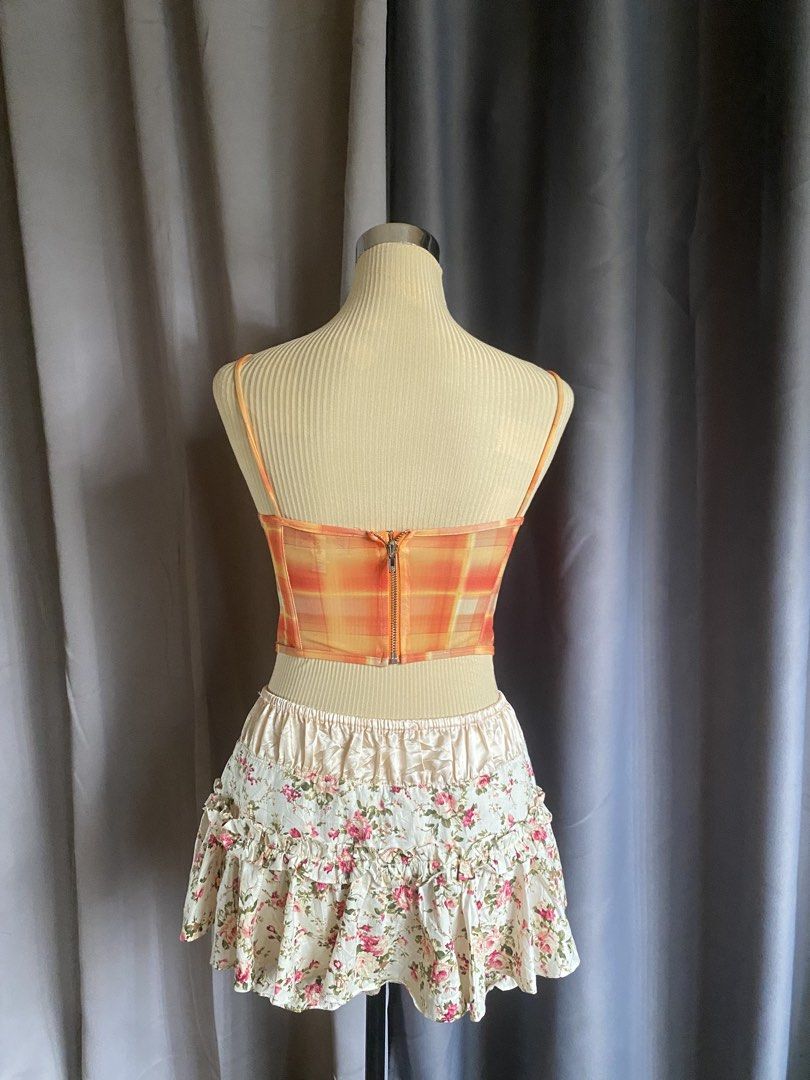 Neon Hart Orange Viccy Check Mesh Corset Cami Top (Category: Sleeveless) located in Cagayan de Oro. Submitted by curated_closetph (Listing ID 1470746607, Image 3). Description: — Size: XS - S — Color: Orange / Yellow Plaid — Lightweight sheer mesh overlay fabrication — Sweetheart neck with fixed thin cami straps — Front criss-cross tie detailing — Pointed asymmetrical hem — Exposed center back zipper closure — Can negotiate the price — 🛒 Shop mo