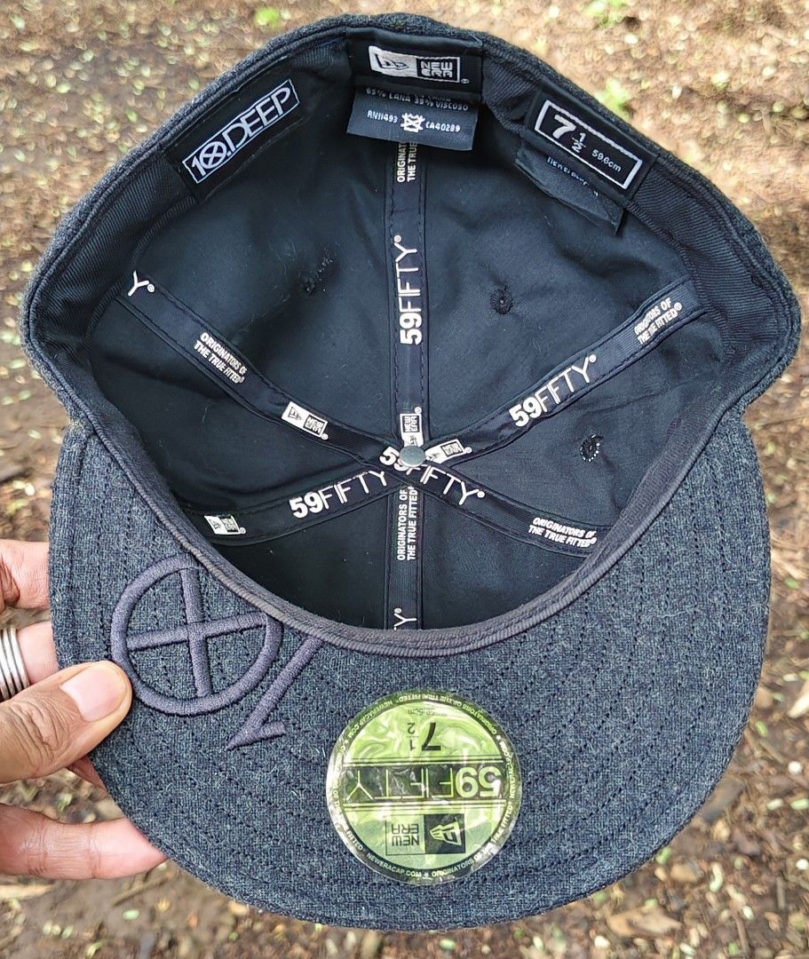 New Era 10 Deep 59FIFTY Fitted Hat Size 7 1/2 (Category: Caps & Hats) located in Manila. Submitted by sansmerci27 (Listing ID 1470903423, Image 2). Description: - Brand: 10 Deep x New Era - Style: Fitted hat with flat brim - Color: Dark grey (wool blend) - Size: 7 1/2 - Details: Colorful patches on front, embroidered logo under brim, original foil size sticker, 59FIFTY interior taping - Condition: Clean, excellent with no flaws.