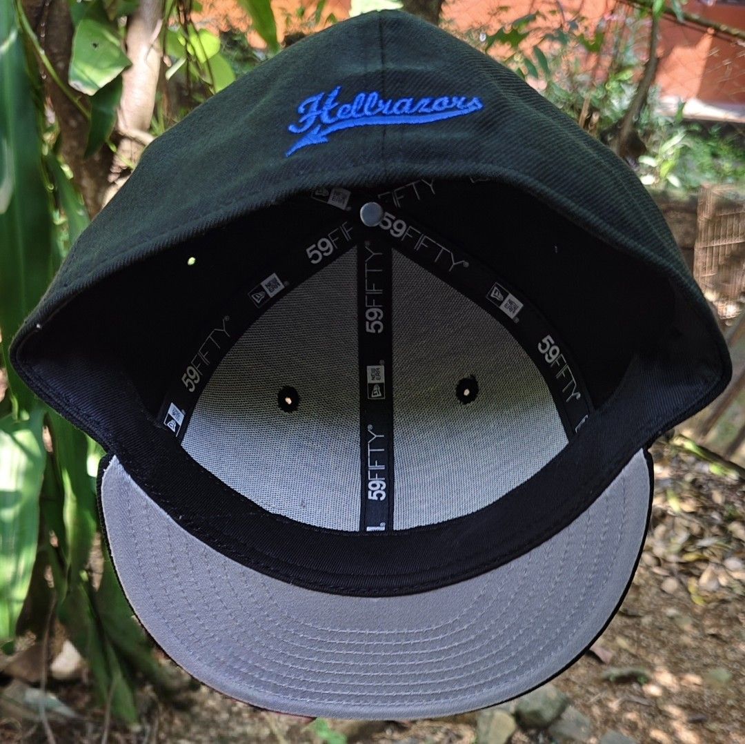 New Era 59FIFTY Hellrazors Fitted Cap Size 7 1/2 (Category: Caps & Hats) located in Manila. Submitted by sansmerci27 (Listing ID 1470902372, Image 2). Description: - Brand: New Era 59FIFTY Fitted Cap - Size: 7 1/2 (sticker still on flat brim) - Color: Black crown with grey undervisor - Details: Blue devil character embroidery on front, Hellrazors script on back - Condition: Brand new, never worn outside, interior taping intact.