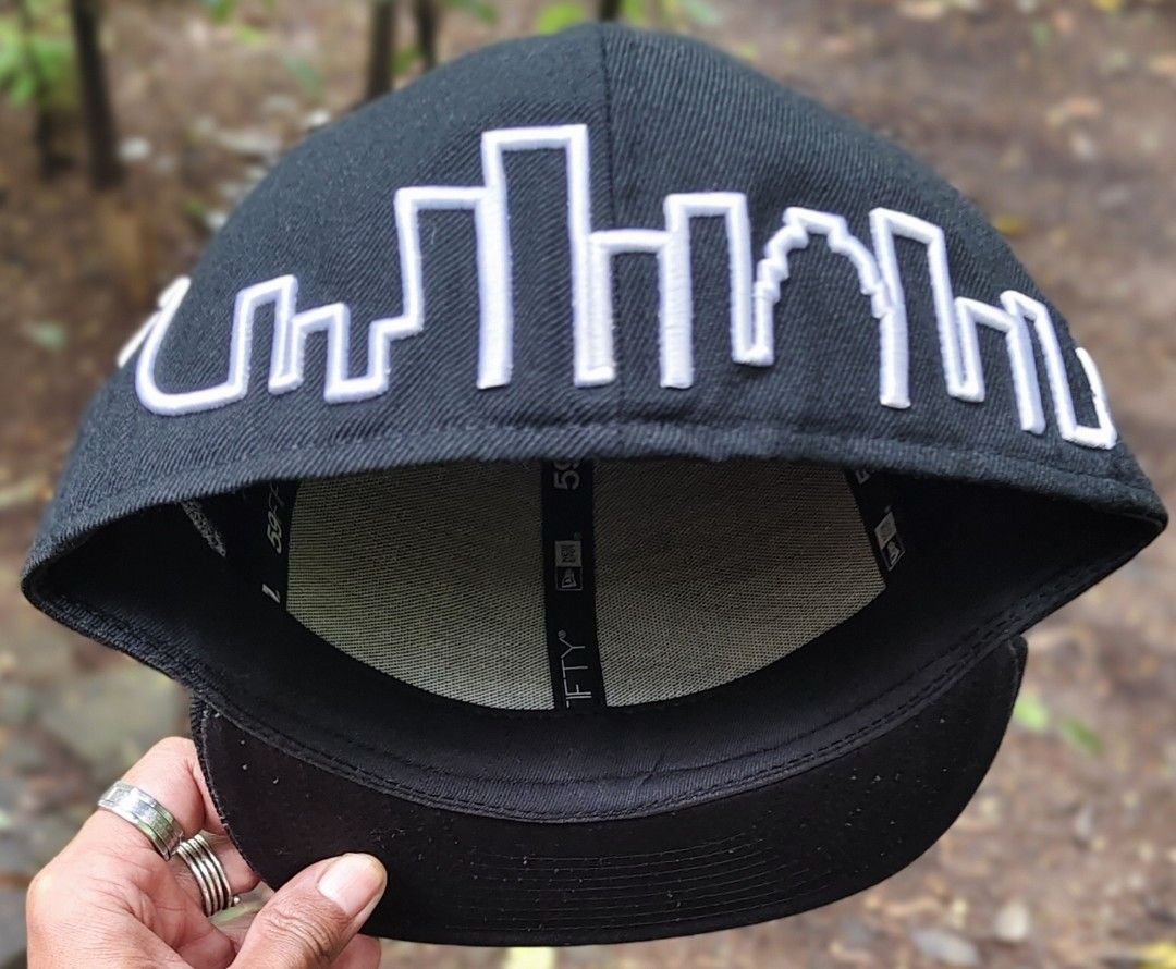 New Era 59FIFTY Microphone Skyline Fitted Cap Size 7 5/8 (Category: Caps & Hats) located in Manila. Submitted by sansmerci27 (Listing ID 1470901556, Image 3). Description: - Brand: New Era 59FIFTY - Style: Fitted cap with structured crown and flat brim - Size: 7 5/8 (gold size sticker still attached) - Color: Classic black - Front Detail: Embroidered microphone graphic with cord wrapping around the sides - Back Detail: White skyline outline embro