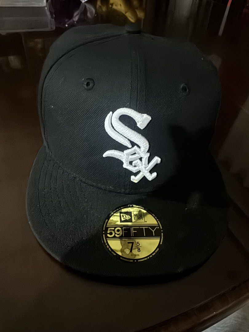 New Era Chicago White Sox 59FIFTY Fitted Cap (Category: Caps & Hats) located in Manila. Submitted by boldstar-f643f3 (Listing ID 1470879971, Image 1). Description: - Brand: New Era - Team: Chicago White Sox - Style: 59FIFTY structured fitted cap with flat brim - Color: Classic black with white embroidery - Size: 7 5/8 - Details: Features interior branding taping and official MLB batterman logo on the back.